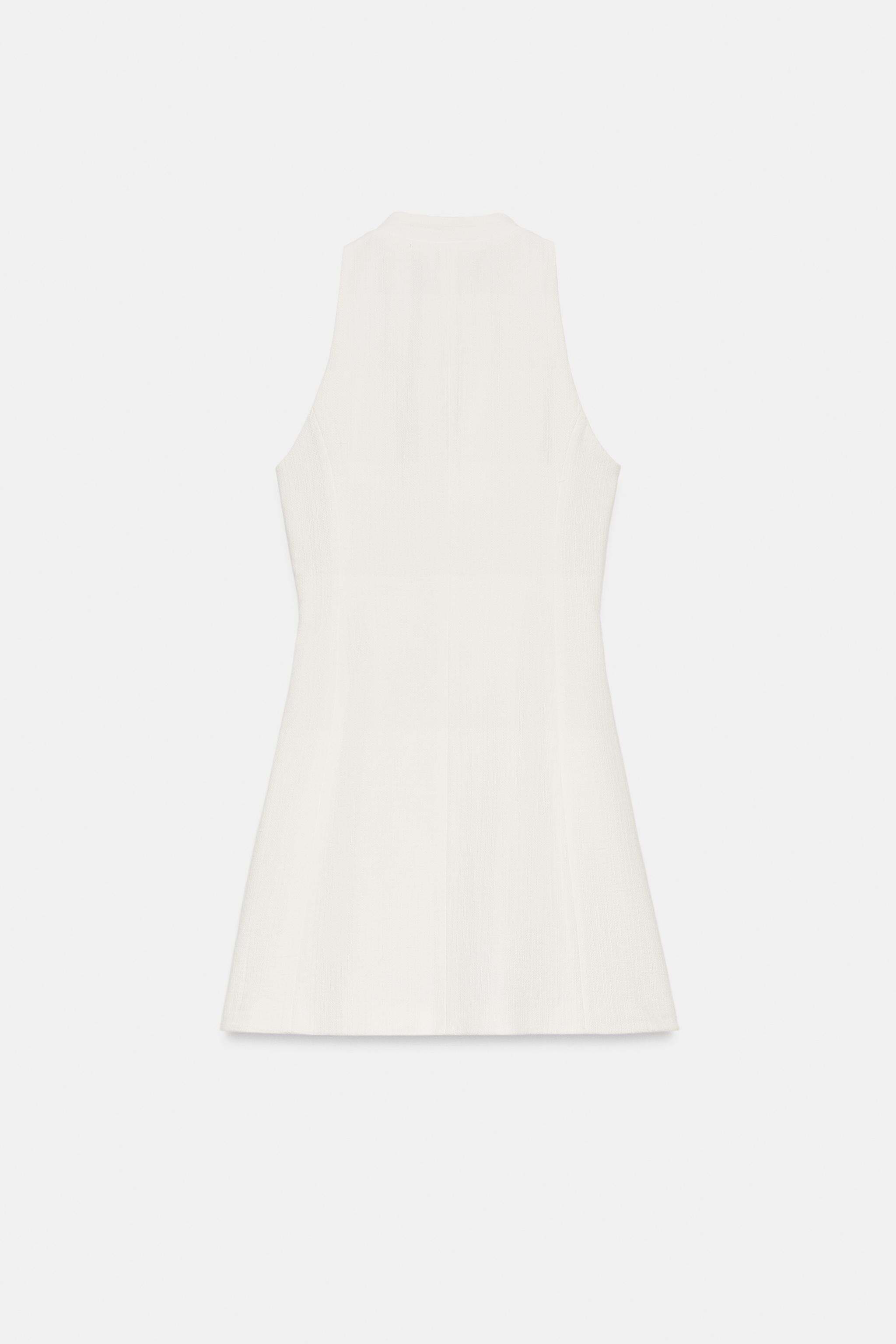 Model height: 178 cmRound-neck, sleeveless dress. Features a fitted waist, decorative double-welt... | Zara UK