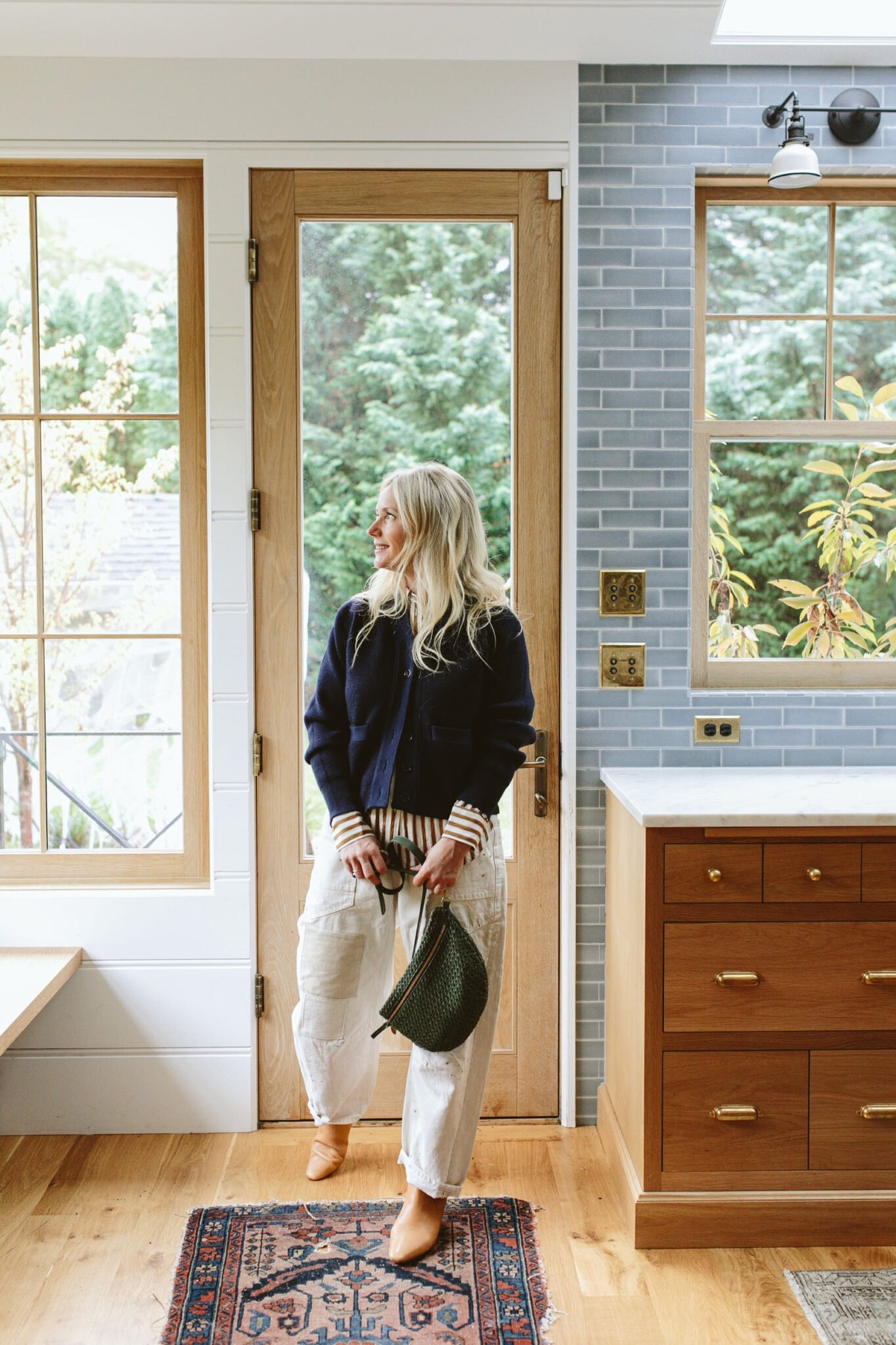 I recently bought this striped button-up which I’ve worn a lot because it’s so good to layer under thicker sweaters. Many poplin or cotton shirts can be too stiff to layer under anything that is fitted (they bunch in the armpits and wrists), but this one is satin-y (polyester probably) and is super thin so it layers and drapes really easily. I’ve had that cardigan for years but those are my new barrel pants that I love (and they are thick and good for cool weather).

#LTKstyletip #LTKover40 #LTKCyberWeek