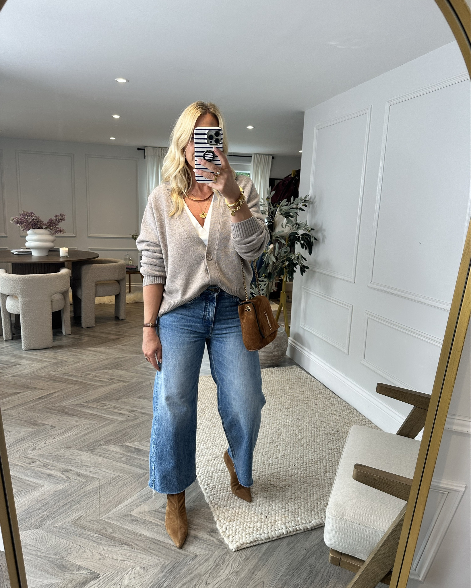 I know I don’t have big boobs (34c) but, I have dressed literally thousands of women with larger chests so I’d like to think I know a little bit about styling the. However, if you’re in any doubt then there’s 32, soon to be 33 body shape masterclasses over on my main channel where you can actually watch me dressing women of all different shapes and sizes live!

Firstly let me just say that we’re not trying to hide big boobs - they’re a great asset in styling but, for some women whose boobs are proportionally larger than the rest of their frame, it can make them look very top heavy. 

In order to re-balance the figure you can do the following

1): Avoid crew neck tops of any sort UNLESS they have shoulder detail (like a shoulder pad or pleats at the shoulder) as these details will broaden your shoulders making the bust look smaller. The crew neck along will make your whole torso look wider. 

2): Avoid any sort of drop sleeve top UNLESS it’s a v neck AND EVEN THEN, I’d try and find a v neck where the seam of the shoulder is ON THE SHOULDER and not half way down your arm. 

3): Roll up your sleeves as this will help to break up the upper torso further and if you’re worried about cold arms then wear a white long sleeve v neck t shirt under the jumper. 

4): V neck tops are the key to styling a larger chest but it doesn’t have to be a standard v neck jumper you can play around with cardigans or zipped hoodies - anything that creates a line through the chest area will be flattering. 

Ps. I’ll be demonstrating this concept on 2 ladies next week over on YT; a size 16/18 lady with a larger chest and a petite 5ft 1 size 12 lady. 

#LTKmidsize #LTKautumn #LTKstyletip
