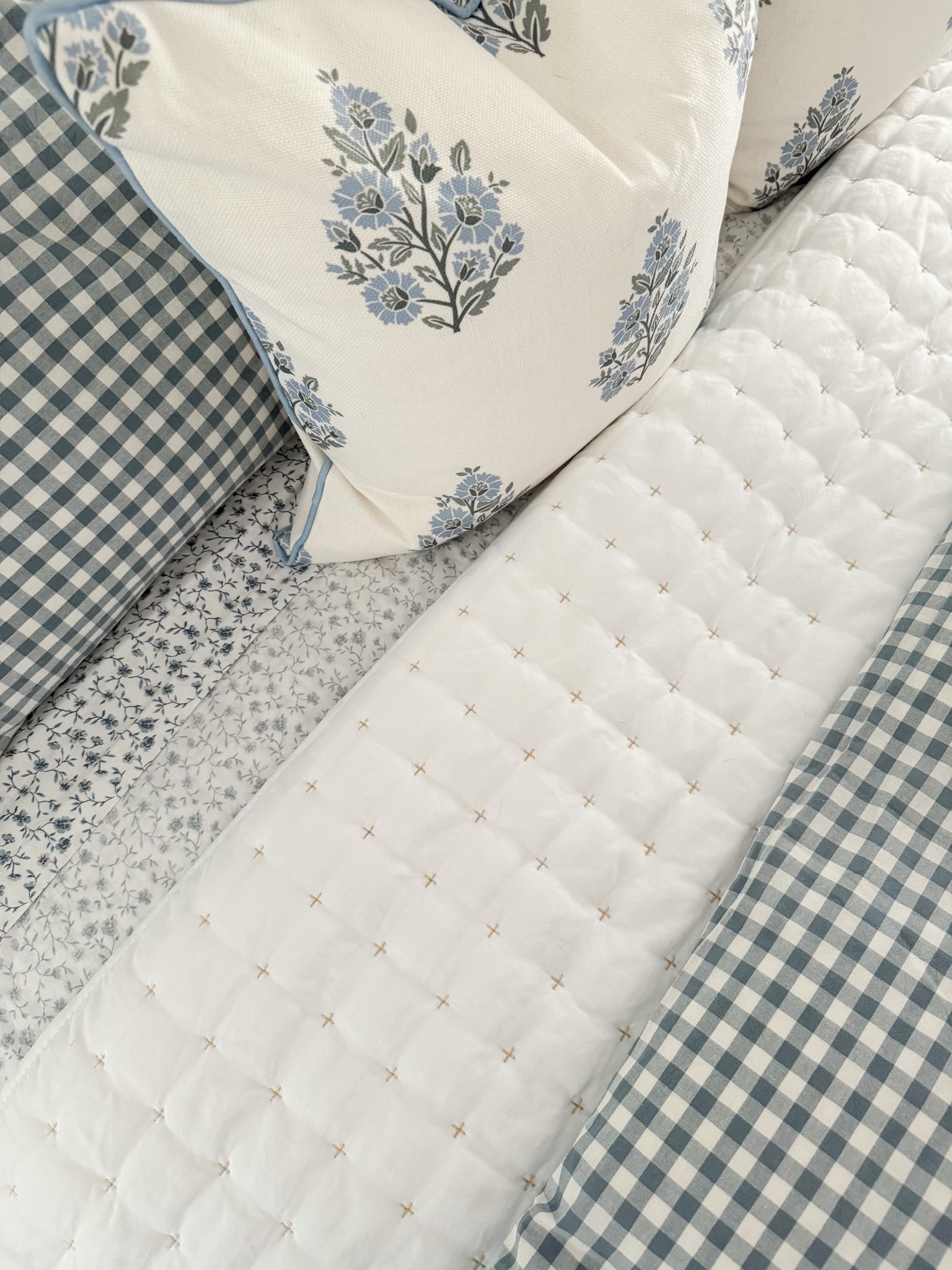 Layered coastal bedroom! This bedroom is all about relaxed layers, soft blues, and classic coastal patterns that make the space feel serene.

#LTKHome