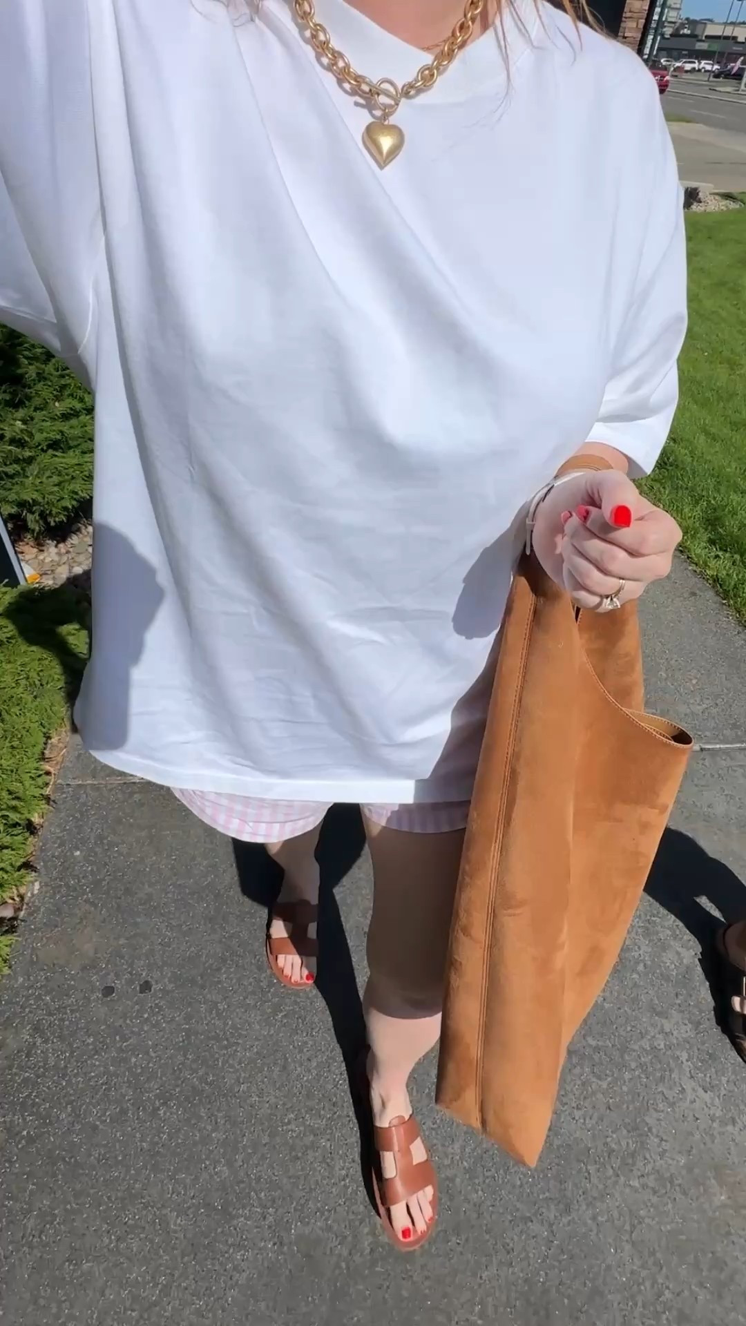 Casual outfit of the day 🌿 This oversized Aerie premium tee and striped poplin shorts are a favourite combo right now - easy, lightweight, and perfect for summer. Styled with simple brown sandals, my heart necklace (Amazon find!) and a brown shoulder bag from Gap. A comfy, casual look that still feels put together for errands, walks, or grabbing a coffee.

casual summer outfit, oversized white tshirt Aerie, striped poplin shorts, American Eagle sandals, Gap brown shoulder bag, Amazon heart necklace, casual walking outfit



#LTKcanada #LTKmidsize #LTKsummer