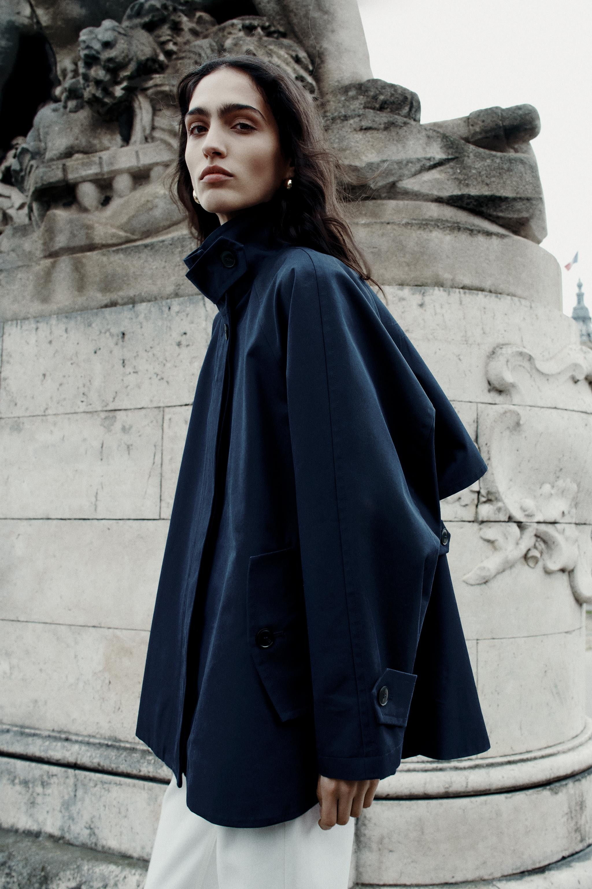 ZARA WOMAN COLLECTIONCape-style jacket with a high neck and tab detail. Wide, long sleeves with a... | Zara US