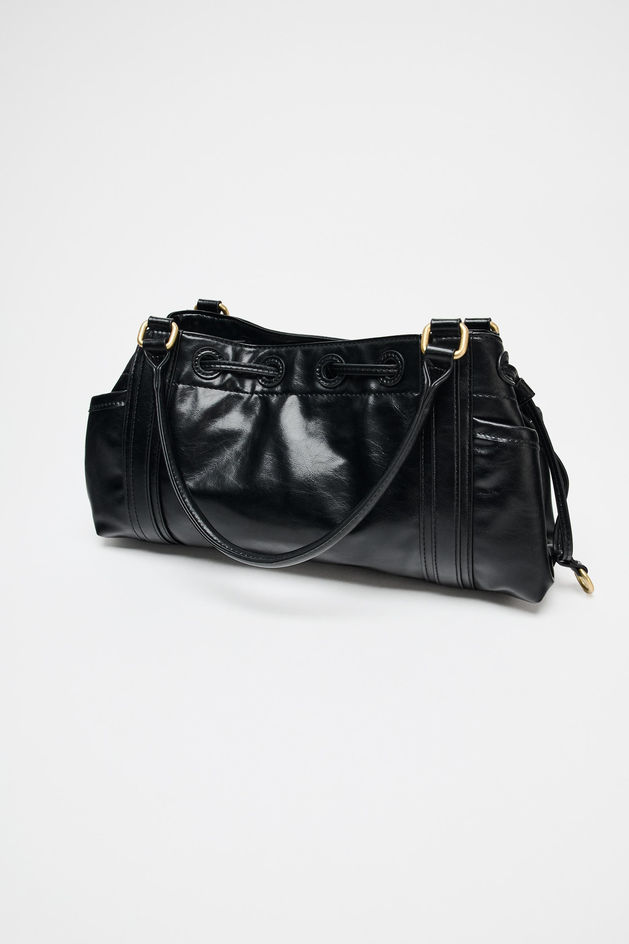Shoulder bag with end pockets. Ruching detail. Double shoulder strap with contrasting metal detai... | Zara US