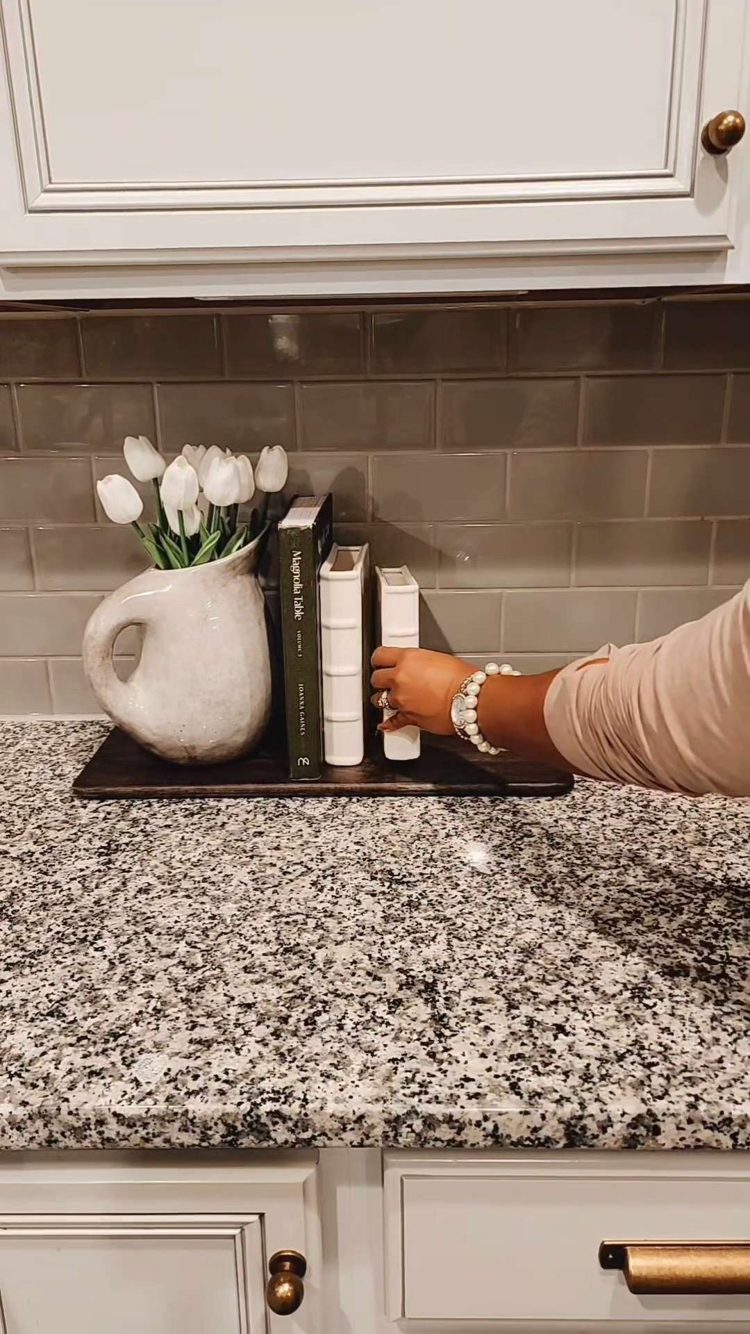 Planning to create a little Spring moment in the kitchen again these ceramic book vases and pitcher. My bread board is old from Target and no longer available Linked an alternative.  

 #LTKSeasonal #LTKHome #LTKSaleAlert