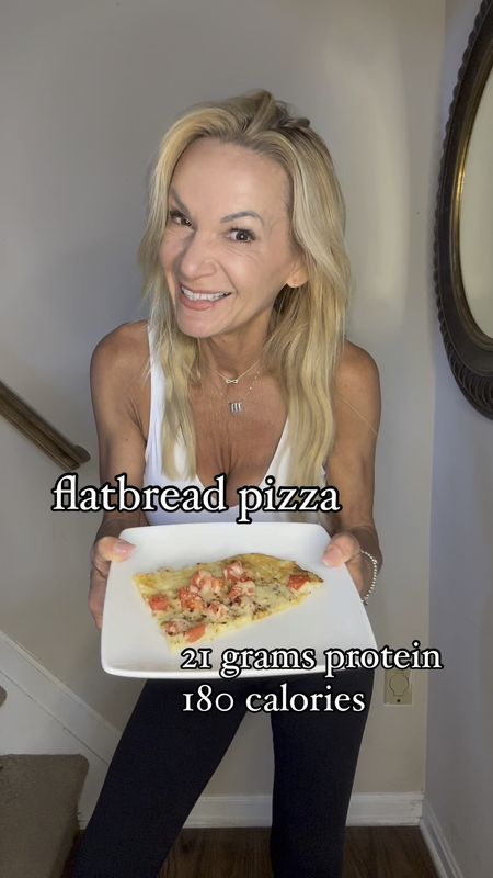PROTEIN FLATBREAD PIZZA- 21 grams protein and 180 calories per piece!

This is so crazy good I can hardly stand it!

one pound 2% cottage cheese
one Roma tomato, diced 
one cup shredded part skin Mozzarella cheese 
salt, garlic pepper, oregano and crushed red pepper

Preheat oven to 350 and line a large baking sheet with parchment paper. 

Spread cottage cheese evenly into a rectangle. Measurements don’t really matter- it’s going to spread a bit as it cooks. Season with salt, garlic pepper and oregano.

Bake for 30 minutes and check on it. If some water is draining out of the cottage cheese remove from oven and carefully drain into sink or blot up with paper towels. 

Bake for another 15 minutes and remove from oven. Top with diced tomatoes and shredded cheese and sprinkle with oregano and crushed red pepper. 

Place back in oven until cheese is melted (about 8 minutes) Remove from oven and carefully cut into four pieces. Use a spatula to remove from baking sheet. It firms up as it cools a bit. 

I can’t wait for you to try this!

xoxo
Elizabeth 

#LTKover40 #LTKVideo #LTKhome