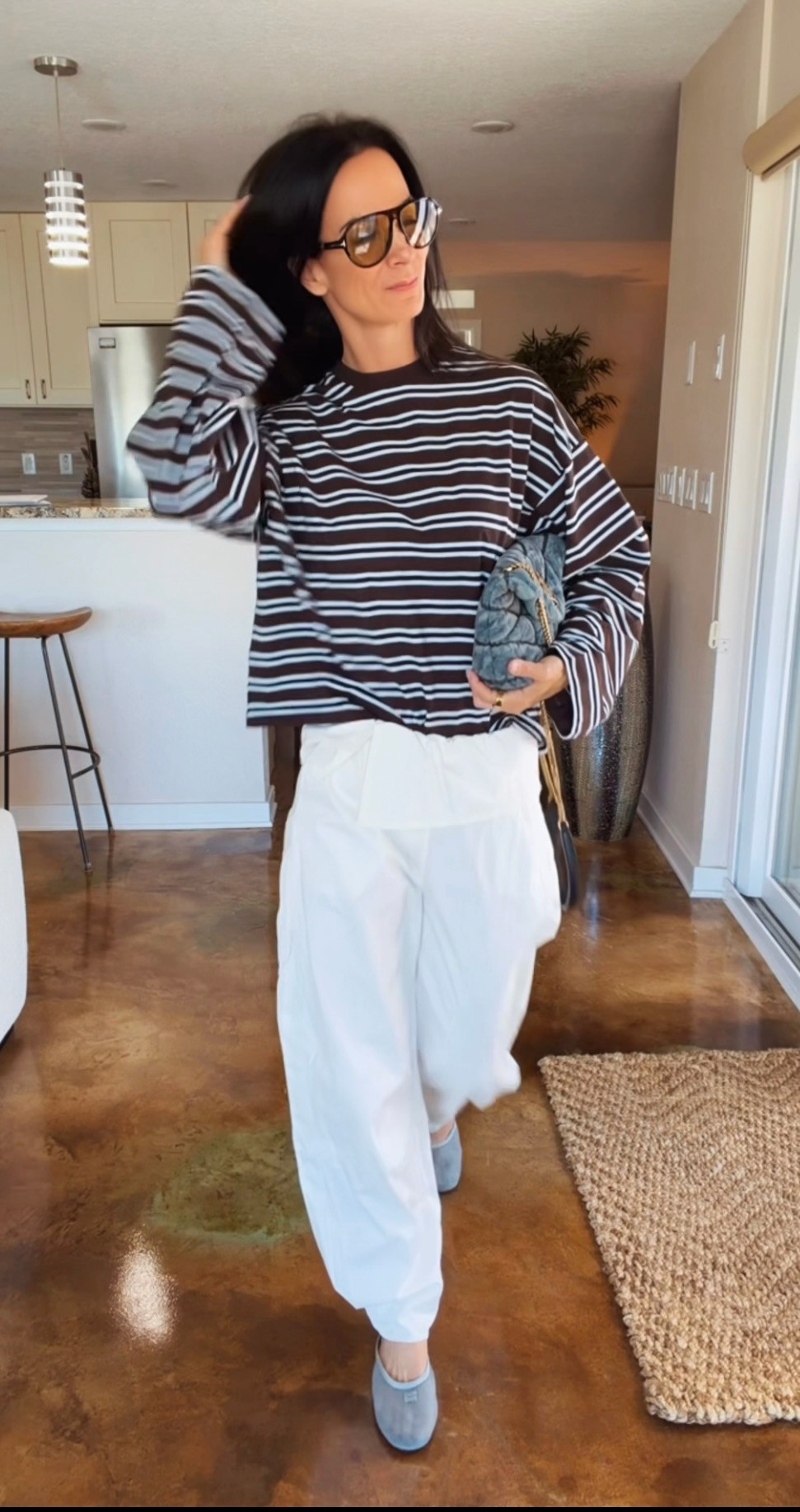 Summer dressing doesn't have to be complicated. 🤎🤍

An oversized striped tee, relaxed white pants, a great pair of sunnies, and a cute bag are proof that simple can still make a statement.

This is the kind of outfit that takes you from coffee runs to lunch, errands, travel days, and everything in between. Comfortable, effortless, and just the right amount of chic.

And honestly... brown and white might be my favorite color combination of the season. 🤎


#NicoleColeeStyle #SummerStyle #EffortlessChic #OOTD #FashionOver40

#LTKdayinmylife #LTKgrwm #LTKootd