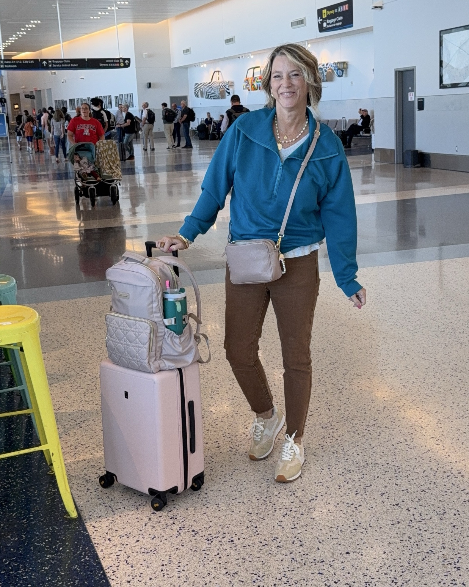 Travel Outfit 💙
Stretchy denim with two buttons for my tummy, easy pullover to layer during cold flights, sneakers that can also be worn to exercise while on vacation, NEW backpack (15.6 laptop version), pink carry-on suitcase, and blush crossbody bag. Travel tip: wear comfortable travel outfits especially if you sit in Row 23 🙋‍♀️

👨‍✈️ I’m a Houston pilot wife sharing tips to help you “travel the globe without a worry in the world” on YTube and IG. #traveltips #founditonamazon @amazonfashion over 40 fashion, midlife style, airport style, outfit for airplane 

#LTKShoeCrush #LTKOver40 #LTKTravel