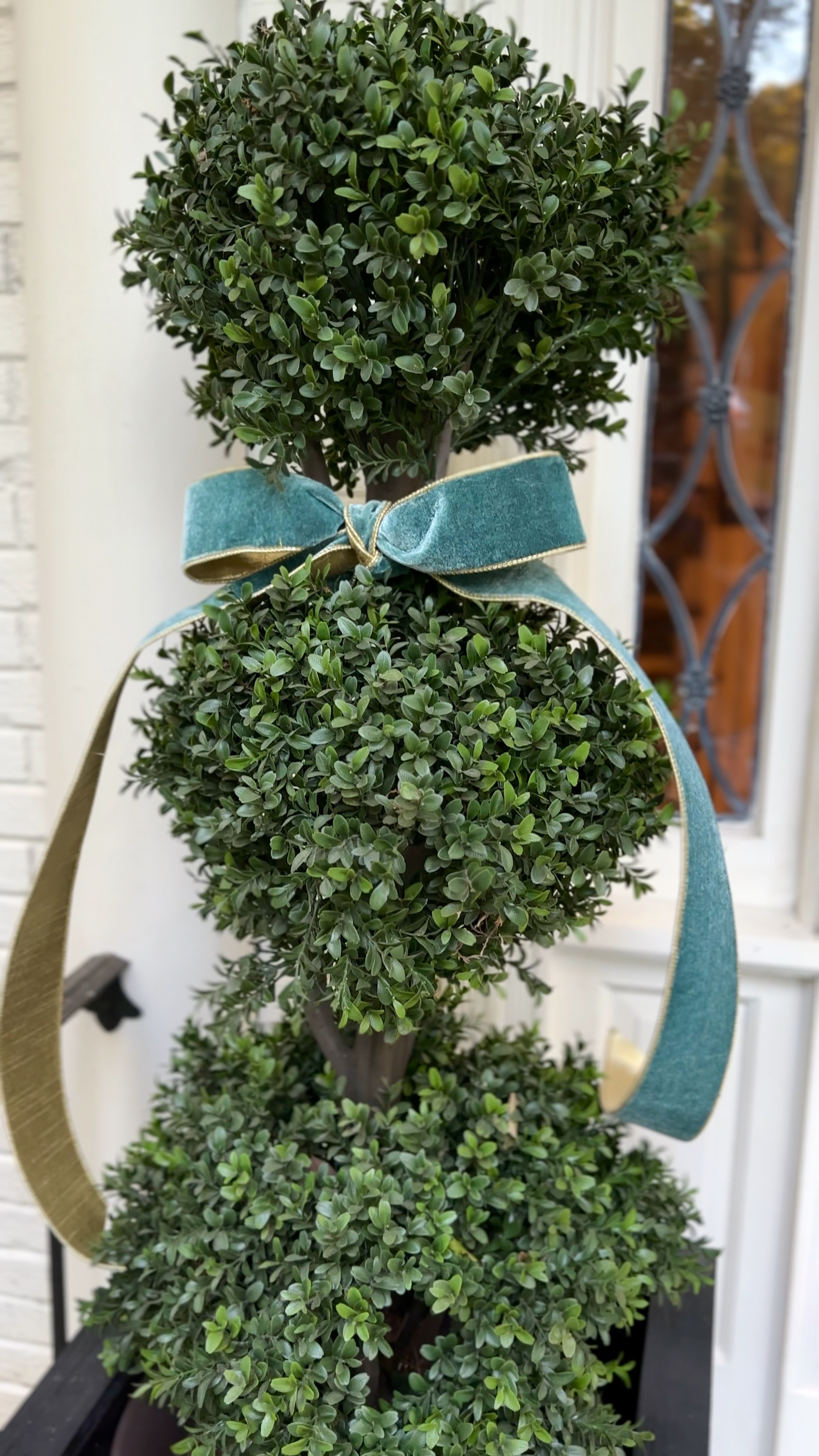 The topiaries that get so much love are now all dressed up for the holidays! Just add a wired ribbon and your front porch is Christmas ready. 

#LTKHome #LTKHoliday #LTKCyberWeek