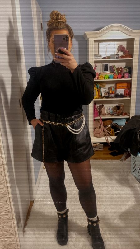 Makeup Artist- Outfit of the day
- black puff sleve top
- sleeveless sweater black turtleneck
- faux leather shorts
- black tights
- jeweled chelsea boots
- black and gold chain belt 

#LTKwedding #LTKfit #LTKunder50