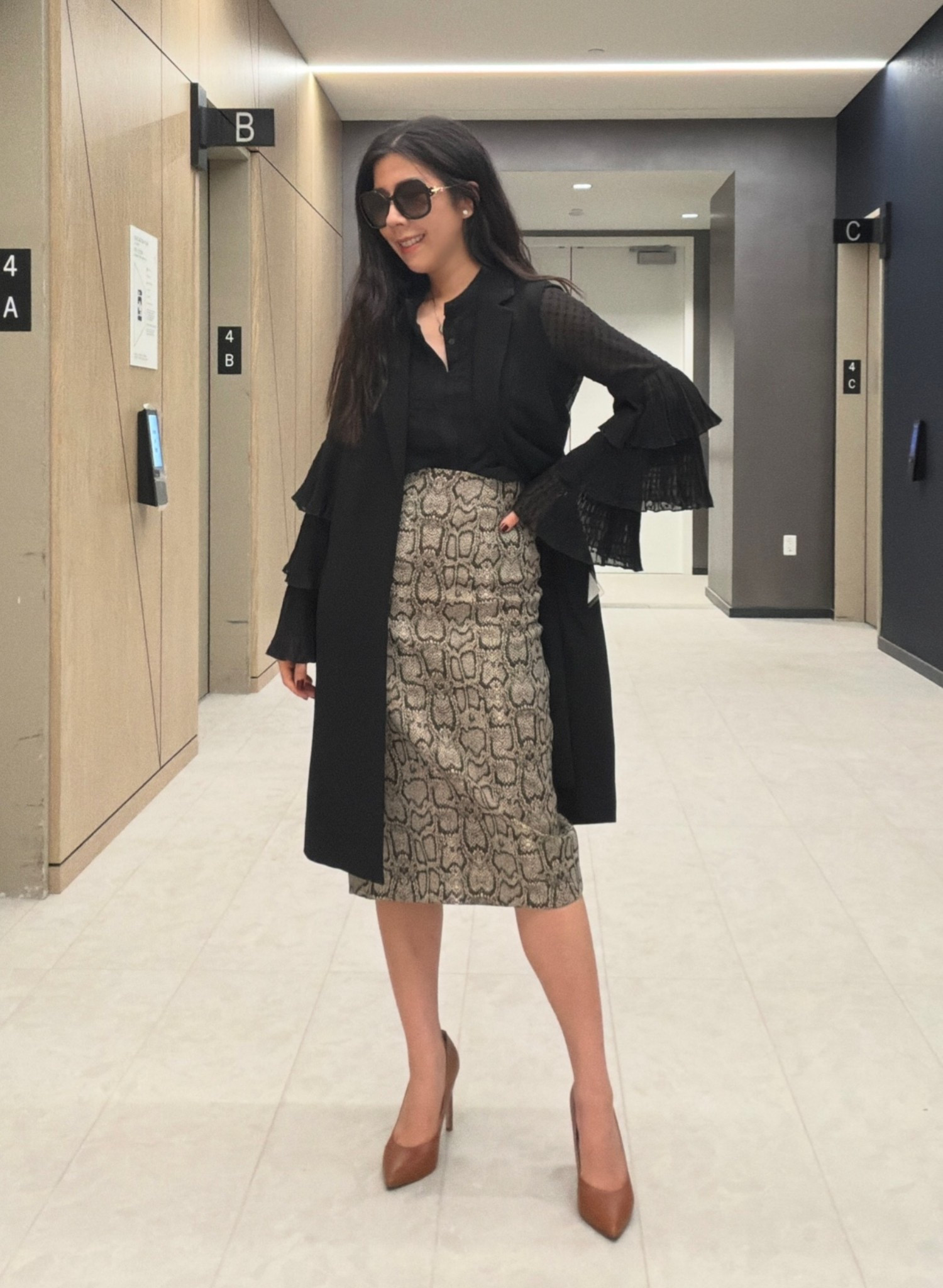 Whenever I want to deviate from an all black outfit, I simply add one bold item. For this look, it’s a snakeskin/python print high waisted pencil skirt. It adds more complexity to an otherwise monochromatic outfit. I also adore anything midi cut because it’s a bit more modest and elegant. 



#corporatestyle #oldmoney #pencilskirt #rufflesleeves #vest

#LTKPetite #LTKWorkwear #LTKootd