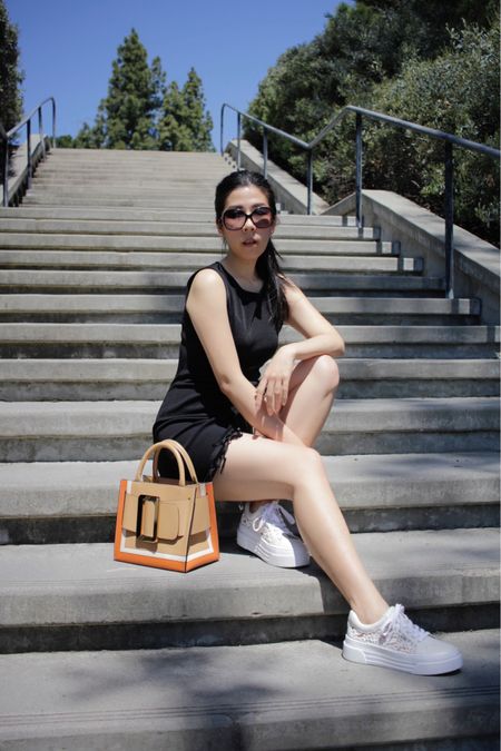 Sometimes all you need is a black and white outfit. I’m wearing my new white lace platform sneakers that are surprisingly lightweight. They’re the perfect white shoes for spring! I paired them with my little black fringe mini dress and my top handle bag! The sneakers make this outfit  casual and great for the weekend! 

#LTKfindsunder100 #LTKshoecrush #LTKsalealert