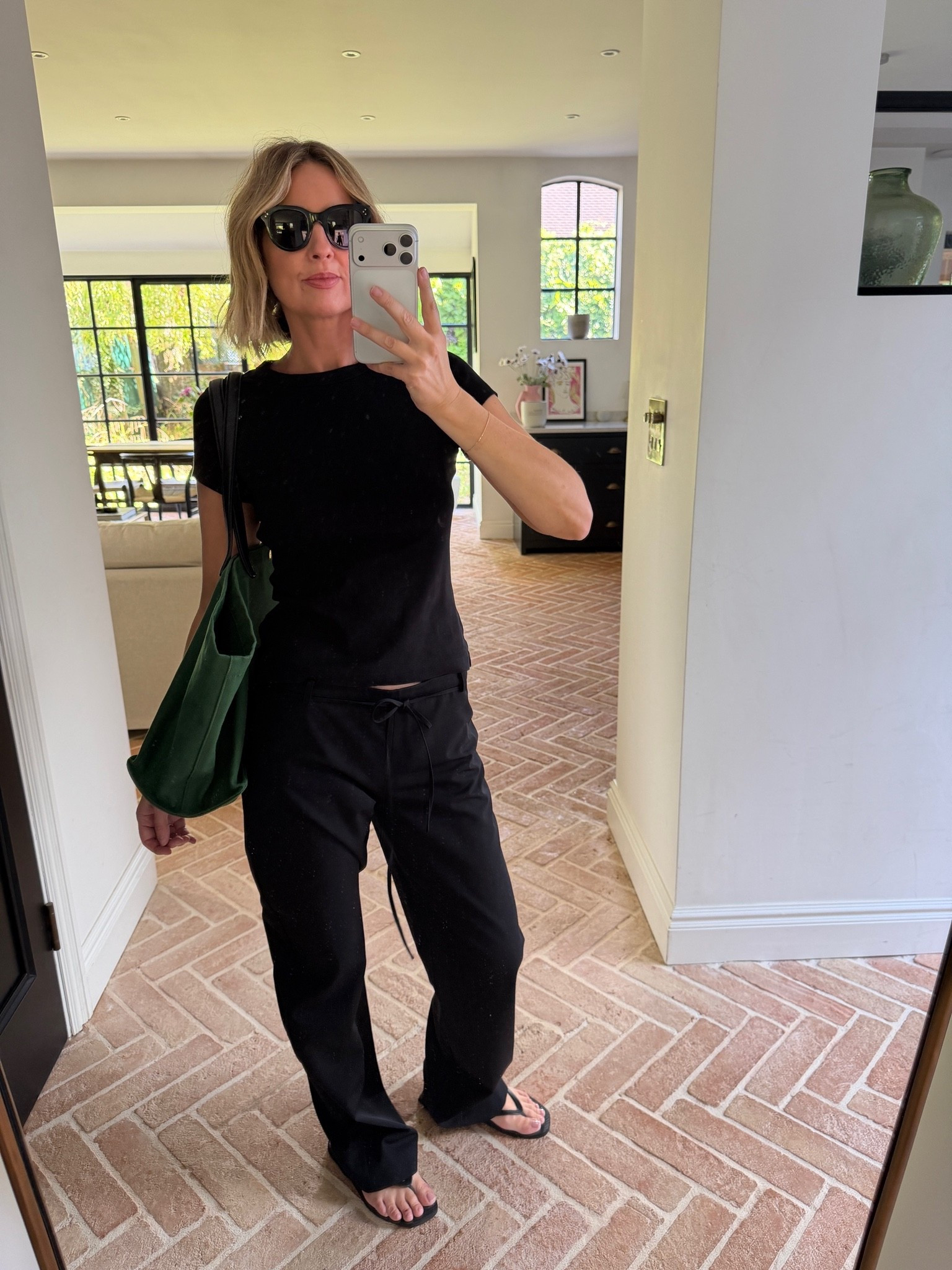 🖤

black fitted t shirt, black drawstring trousers, all black outfit, black strappy sandals, green tote bag, black cat eye sunglasses, gold bracelet, casual chic outfit, off duty style, monochrome styling, minimalist chic, elevated basics, quiet luxury, neutral color palette, mirror selfie ootd, ltkstyletip, ltkseasonal, ltksummer, ltkfindsunder100, ltkbeauty, ltkitbag

#LTKdatenight #LTKworkwear #LTKstyletip
