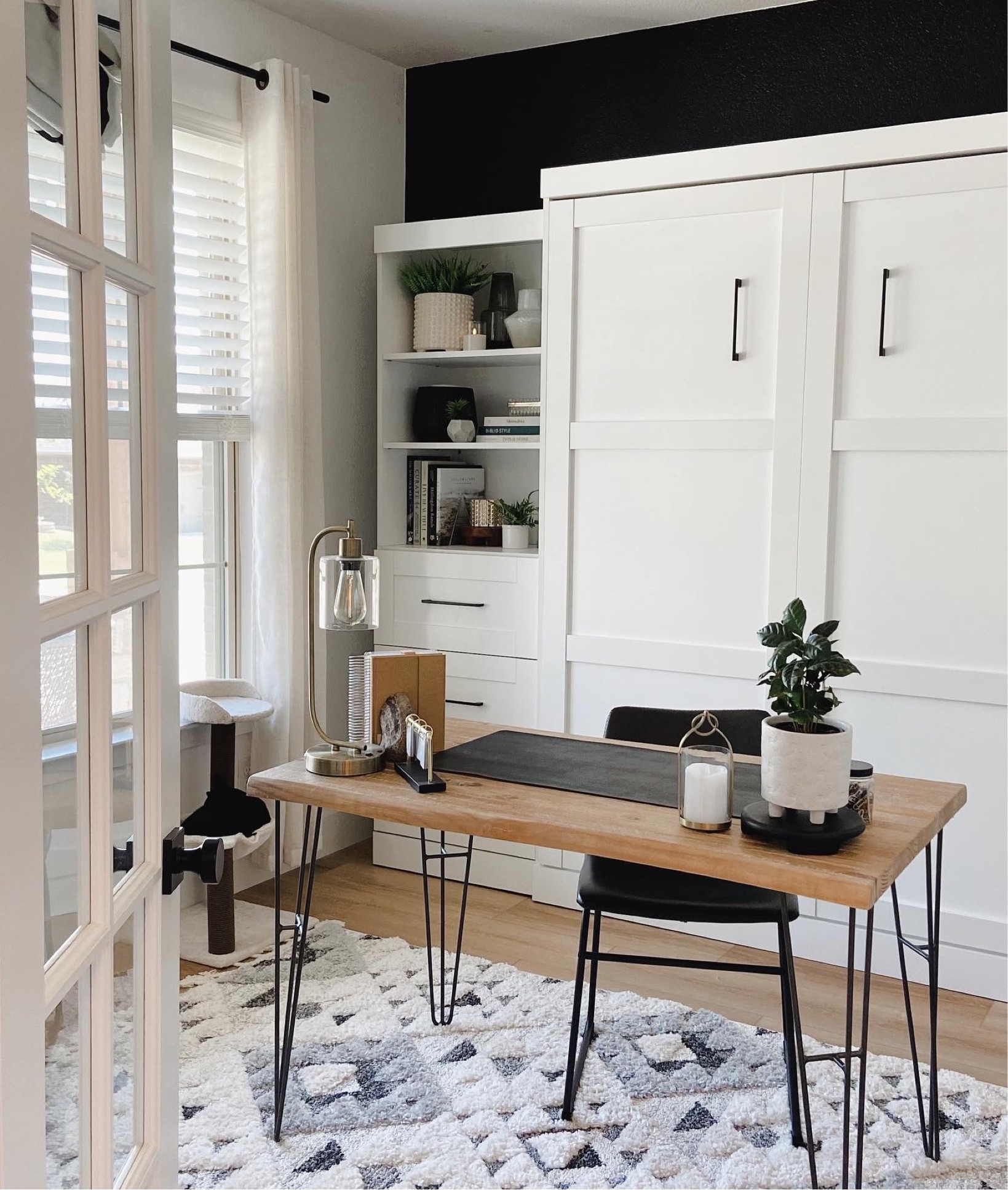 Looks like built in cabinets, right?! But guess what? It’s a bed! This Murphy bed was the perfect solution to us needing a bedroom on the first floor but also needing an office space. 

Boho rug, Walmart rug, office 

#LTKsalealert #LTKunder100 #LTKhome