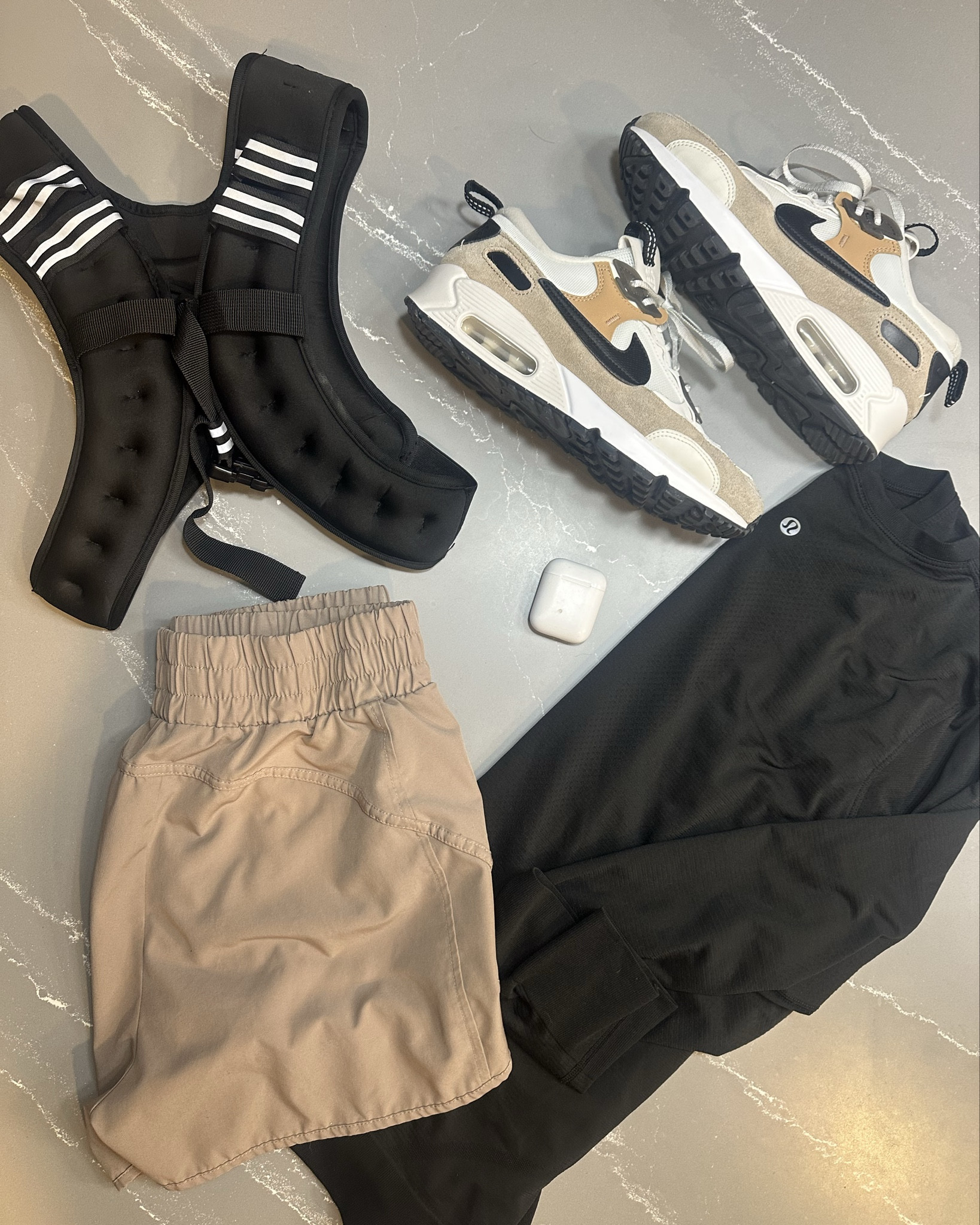 Weighted walking has been a game changer for me this year. And it adds a little more difficultly to my walks and workouts. 
My weighted walk staples: 

Weighted vest, ofc. We have two versions — this one is a 12lb and comes in a bunch of different weights and is the best way to start off. And the second one we sized up to 20-32lb adjustable vest so you can start lighter and work your way up. 

Air Max are my favorite sneaker right now + these neutrals are so good! Fit TTS

A good pair of shorts that won’t roll or move around - I love these lookalike FP shorts even more than the actual bc this waistband is not as wide and fits so well. Come in a ton of colors, zip pocket on the size. I wear a small. 

My favorite LS is this swiftly. Great for layering if it’s chilly, golfing, lounging. I wear a size 8

And of course my AirPods so people can’t listen to my music 😉

Not shown: my favorite wear all the time sports bras and the best no-show socks. Yep, I still wear no show socks 😅 And can’t forget the Apple Watch to track all those steps — I’m afraid I’m becoming addicted to that thing 

#LTKOver40 #LTKActive