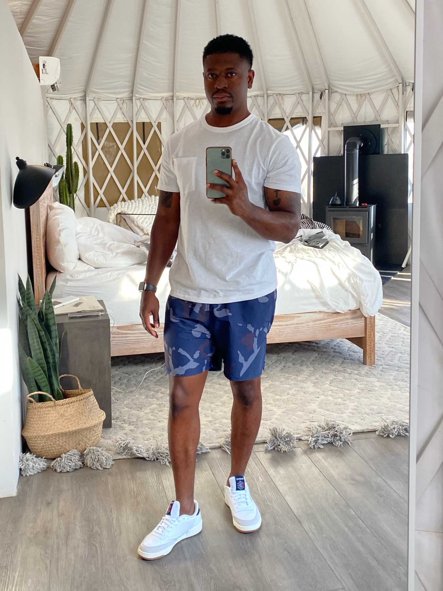 White tee paired with Reebok sneakers and blue camo shorts 

#LTKshoecrush #LTKmens #LTKtravel