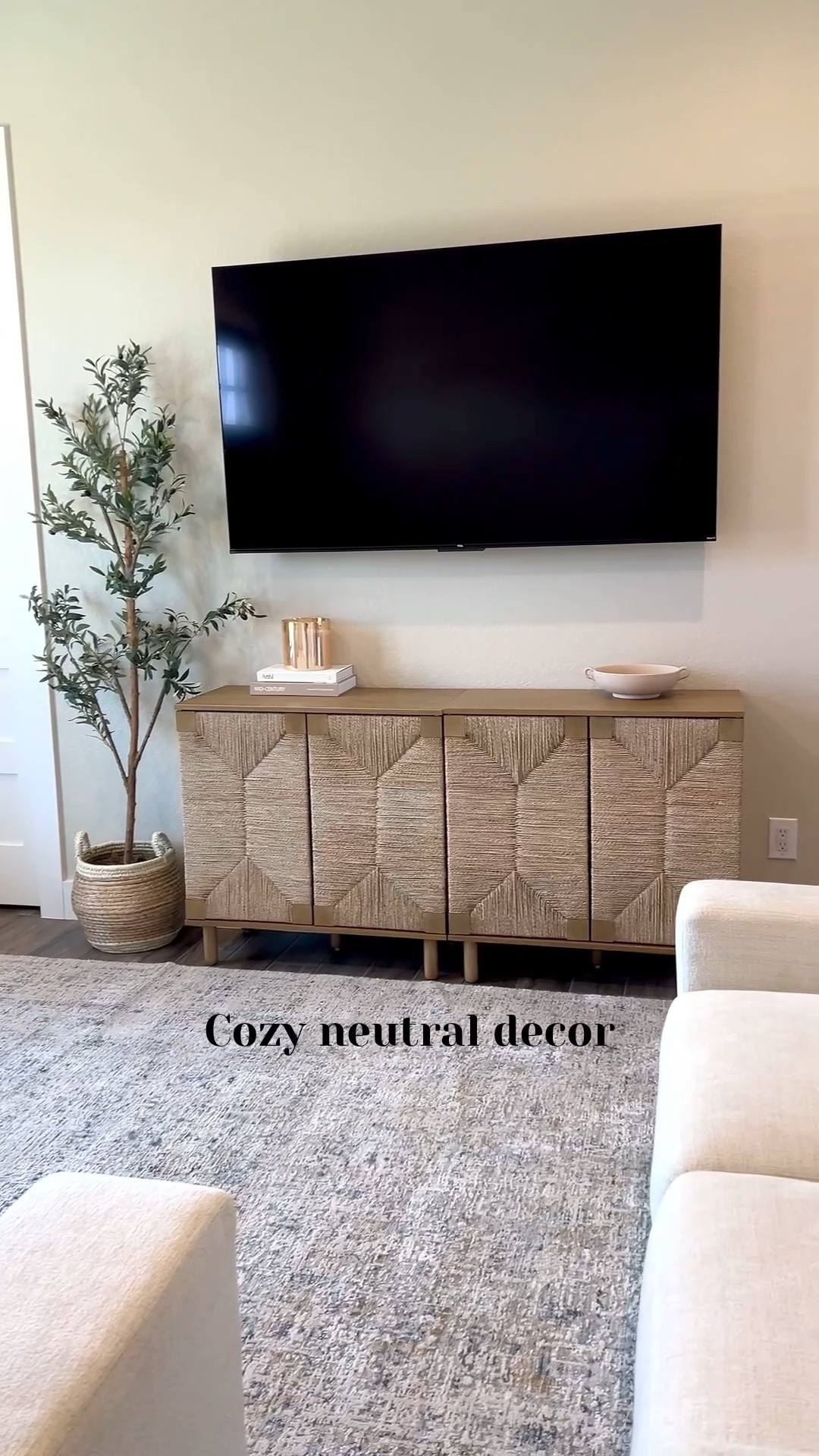 Keeping our space at home cozy and neutral. ✨

Home decor, home accents, neutral tones, neutral home, couch, living room, tv entertainment cabinets, olive tree, area rug, tv 

#LTKHome