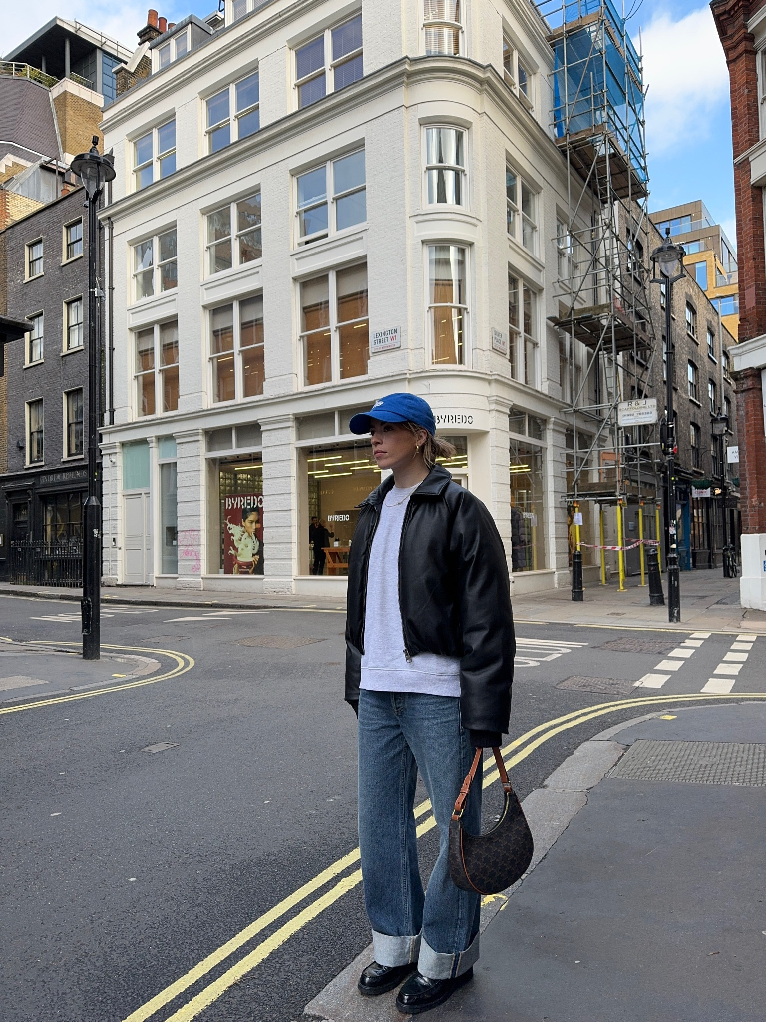 Blue cap, grey sweatshirt, black leather jacket, blue wide leg jeans, leather shoulder bag, black leather loafers

#LTKstyletip #LTKSeasonal #LTKeurope