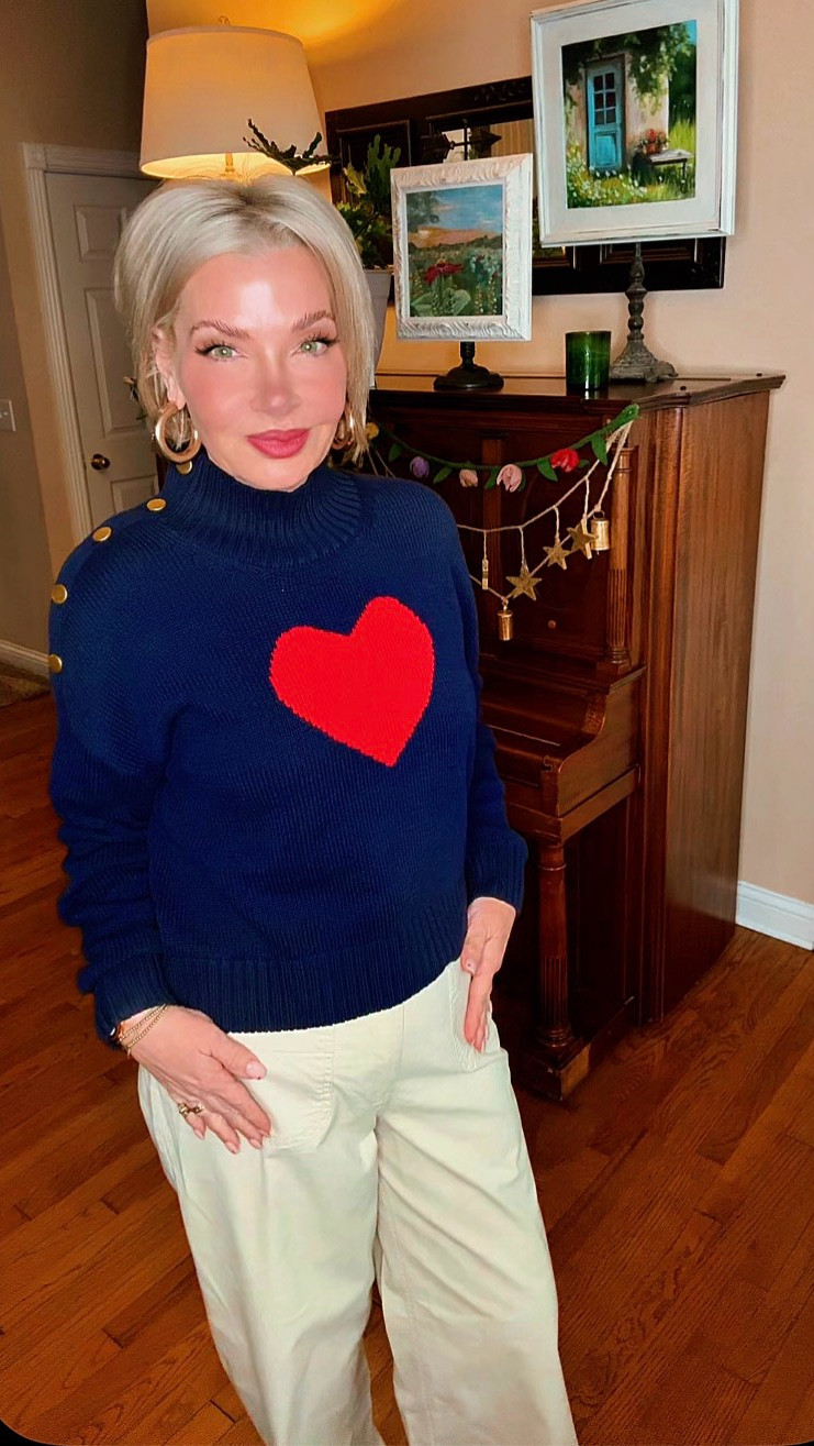 The navy keeps it polished. The bold red heart gives it personality and those gold shoulder buttons? That’s the little elevated detail that makes it feel boutique instead of basic. Anthro vibes. Walmart budget.
Gen X math says that’s a win. 💙

#LTKootd #LTKSaleAlert #LTKSeasonal