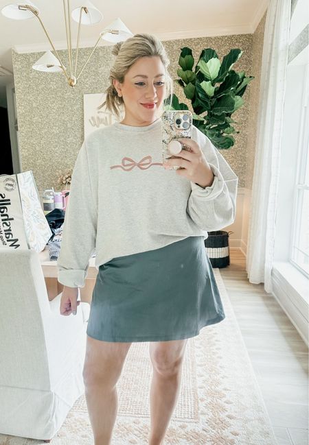 Obsessed with this sweatshirt!! You can customize it to whatever color you want! Threw it over this athletic dress. This is the Heather gray sweatshirt with mauve bow. 

THEBLOOMINGNEST cozy style sweatshirt skirt bow athletic dress 