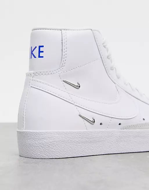 Nike Blazer Mid 77 trainers with metallic mini swoosh in white | ASOS (Global)