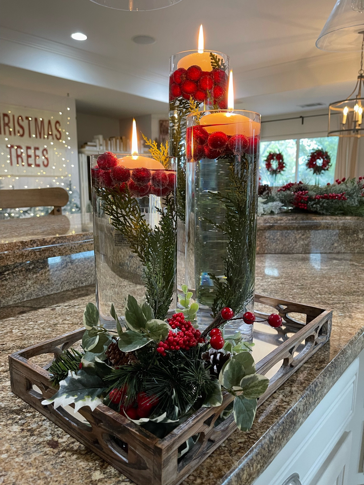 This Holiday floating candle centerpiece is so easy to make! All you need are some glass cylinder vases, some faux or real cranberries, faux or real floating candles and VOILA! 

#LTKhome #LTKHoliday #LTKSeasonal