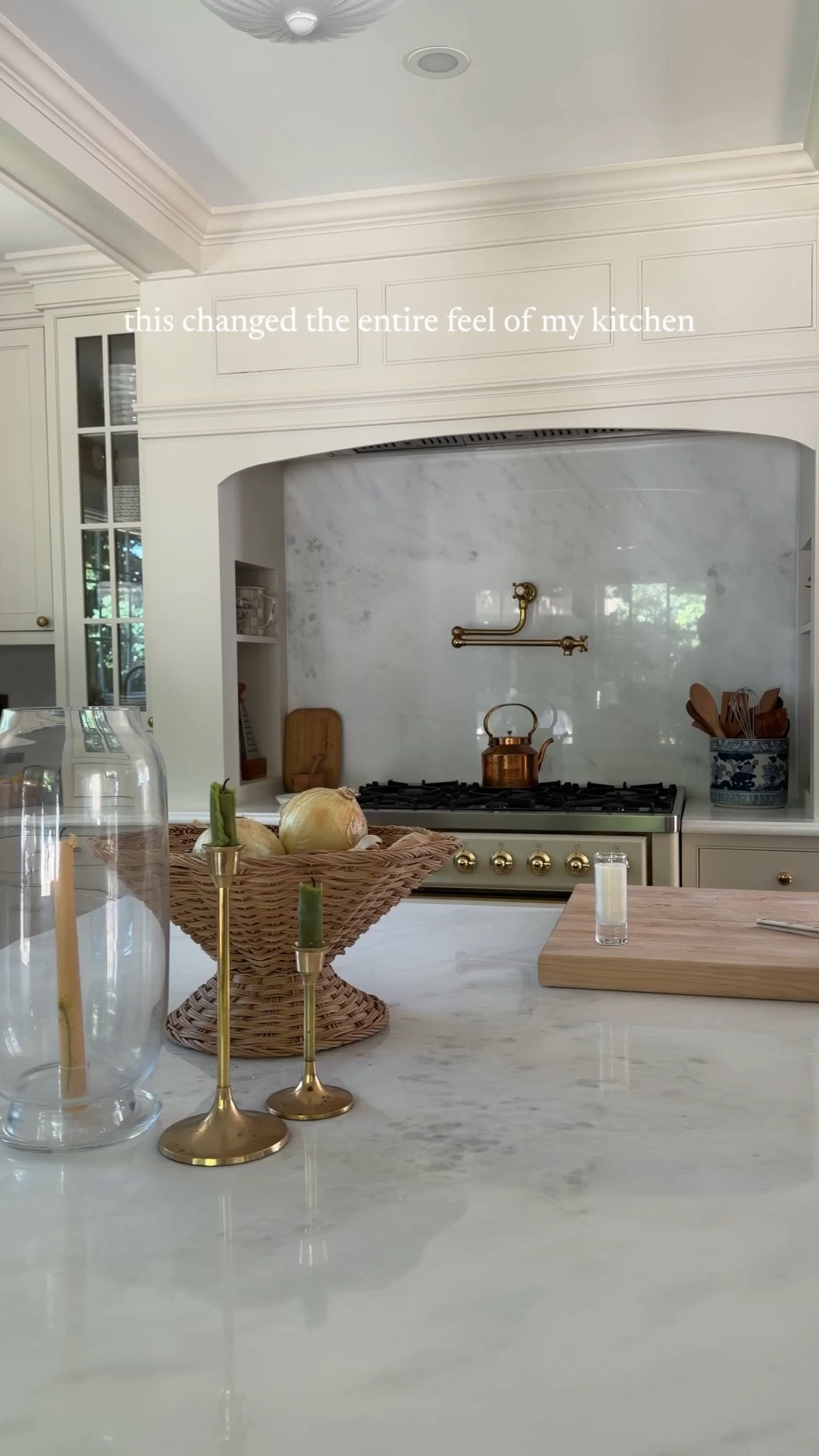 I knew I wanted a neutral kitchen. I also knew I didn’t want it to be a boring one.

So instead of relying on color to give it character, I focused on warmth and contrast. The creamy paint and warm-toned cabinetry were intentional from the start: they created a softer neutral base rather than a sea of stark white. But the part that really changed the entire feel of the room came after.

Here’s the formula: Warm woods, aged brass, woven textures, darker furniture., cutting boards left out on purpose, and collected pieces that don’t perfectly “match.”

Those layers are what took the kitchen from feeling like a freshly renovated neutral space to one that feels warm, lived-in and like it belongs to us.

So if you love a neutral kitchen but are worried about it falling flat, don’t necessarily add more color. Add more warmth, mix your wood tones, bring in natural materials, and let your metals add another layer. Give all that neutral something to play against.

Comment SHOP and I’ll send you links to everything you see here, plus our paint colors, cabinet details + more.