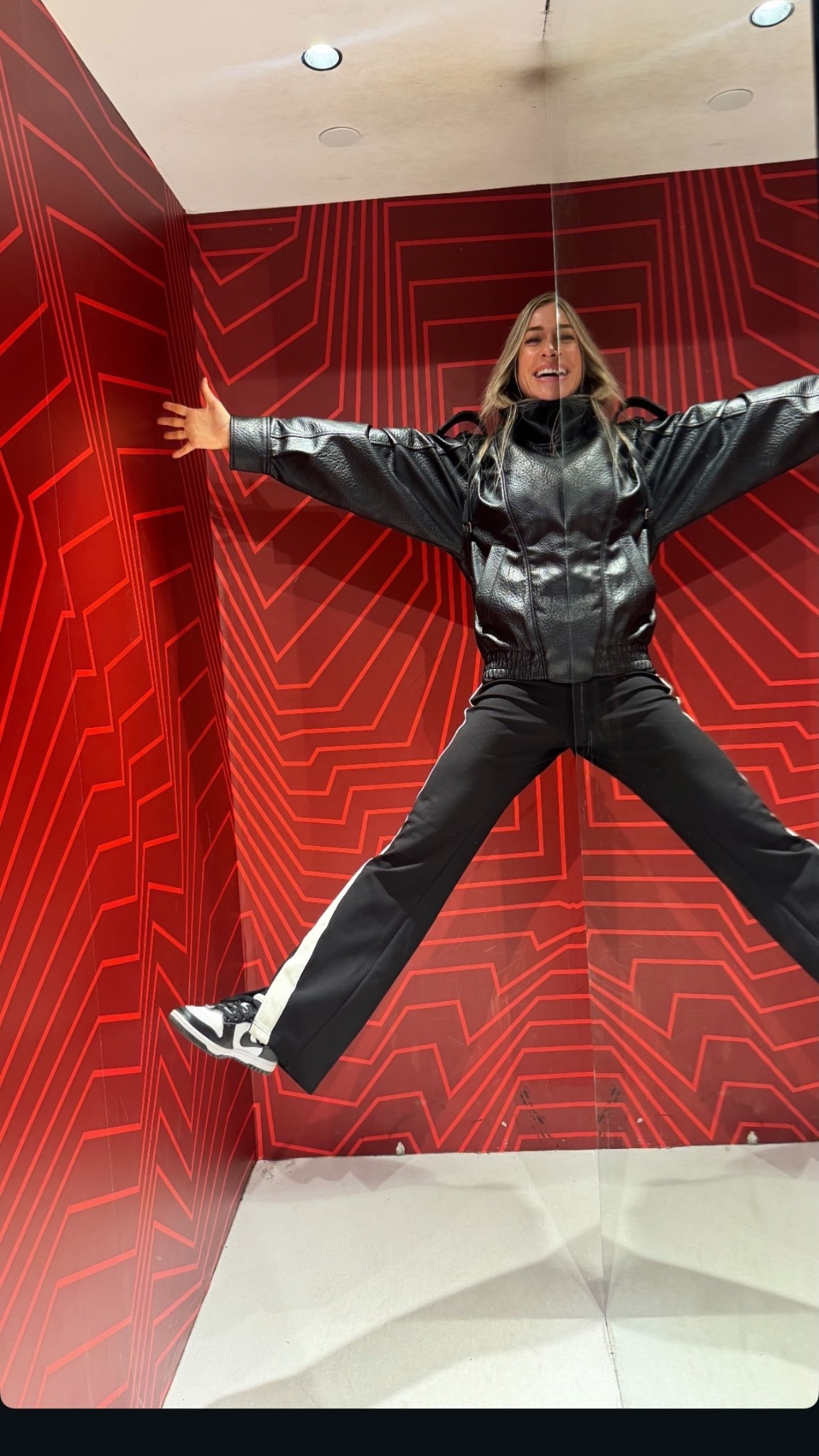 Kristin Cavallari black white side stripe jersey flare pants viral best selling restocked funnel neck leather jacket ￼