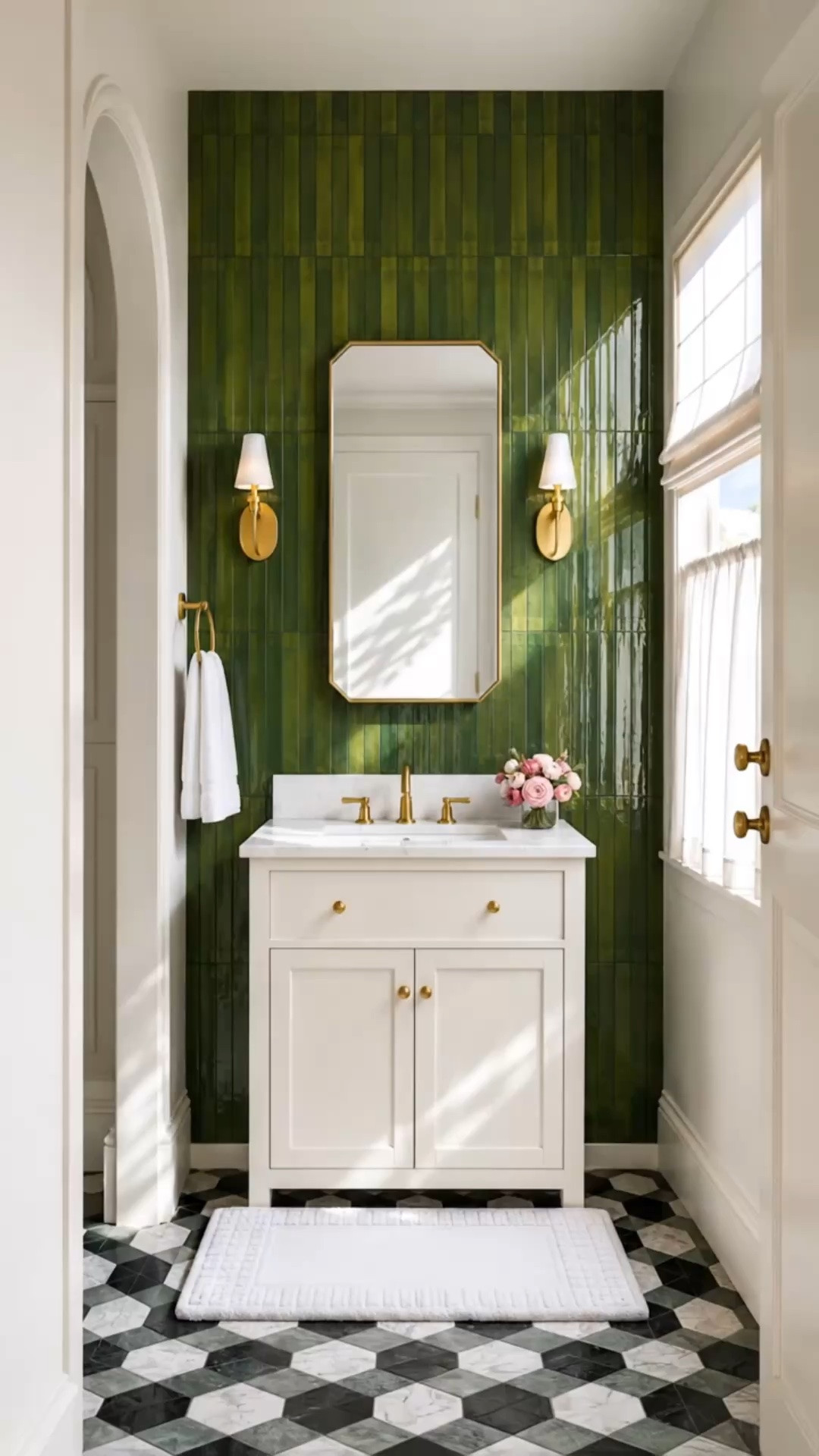 In summer, I always find myself drawn to green. It has such a calming presence—fresh, restorative, and perfect for creating that quiet sanctuary feeling, even in a small powder room.

This space features the new Claude™ Bathroom Collection by KOHLER x Studio McGee, inspired by historic architectural details and reinterpreted with a refined modern-classic sensibility. The vanity and softly chamfered mirror bring timeless structure, while the deep green vertical tile adds richness, texture, and a beautiful sense of depth. 
A relaxed Roman shade softens the sunlight from above, while the white café curtain adds privacy without blocking the brightness—keeping the room airy, layered, and inviting.

#powderroom #bathroomdesign #bathroomvanity #vanitymirror #bathroomsconce #walltile #greentile #romanshade #cafecurtain #windowtreatments #studiomcgee #kohler #claudecollection #modernclassic