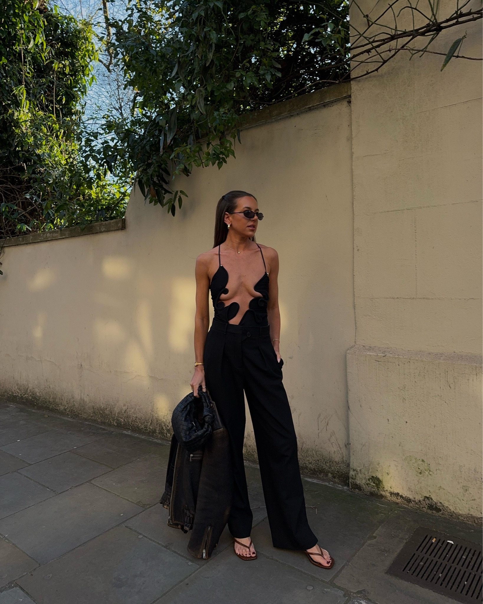 Christopher Esber bodysuit | Joseph trousers | Prada jacket | YSL sunglasses | RAYE sandals

Party wear, all black outfit, cut out top, tailored trousers, leather jacket, heeled sandals, going out outfit, chic outfit

#LTKsummer #LTKpartywear #LTKuk