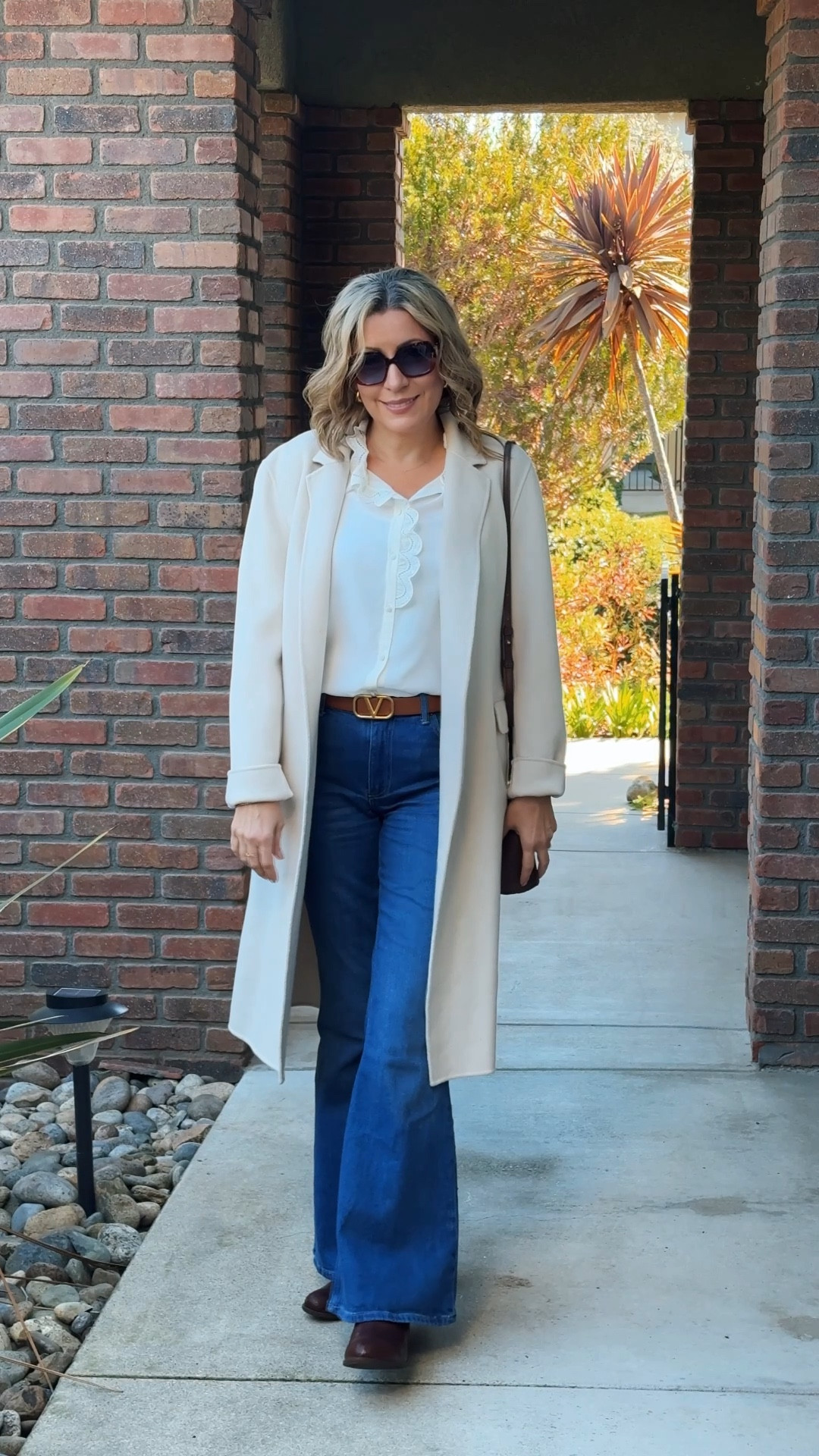 Elegant and timeless winter layers ❄️ Featuring a creamy tailored coat over a delicate scalloped blouse for a sophisticated touch. Paired with high-rise flared jeans and classic brown leather boots for a polished yet effortless look. Perfect for staying chic in cooler weather 🤍 #winterfashion #timelessstyle #effortlesschic #fashionover40 #stylishandgrateful

#LTKWatchNow #LTKMidsize #LTKOver40