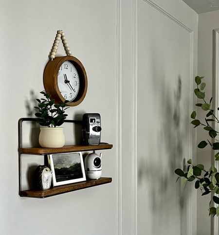 This little shelf came in handy for a really cute accent with texture and depth, but also for practical reasons with a spot for that baby monitor in the nursery. And I think this beaded clock is adorable with it. And bonus, everything in this pic is super affordable. 

Brass and wood shelf
Mini potted plant
Vintage camera
Wooden hedgehog animal accent for kids room
4x6 white and gold frame
Baby recommendations
Nursery decor and styling
Small wall clock
Faux eucalyptus tree

#LTKbaby #LTKfindsunder50 #LTKhome