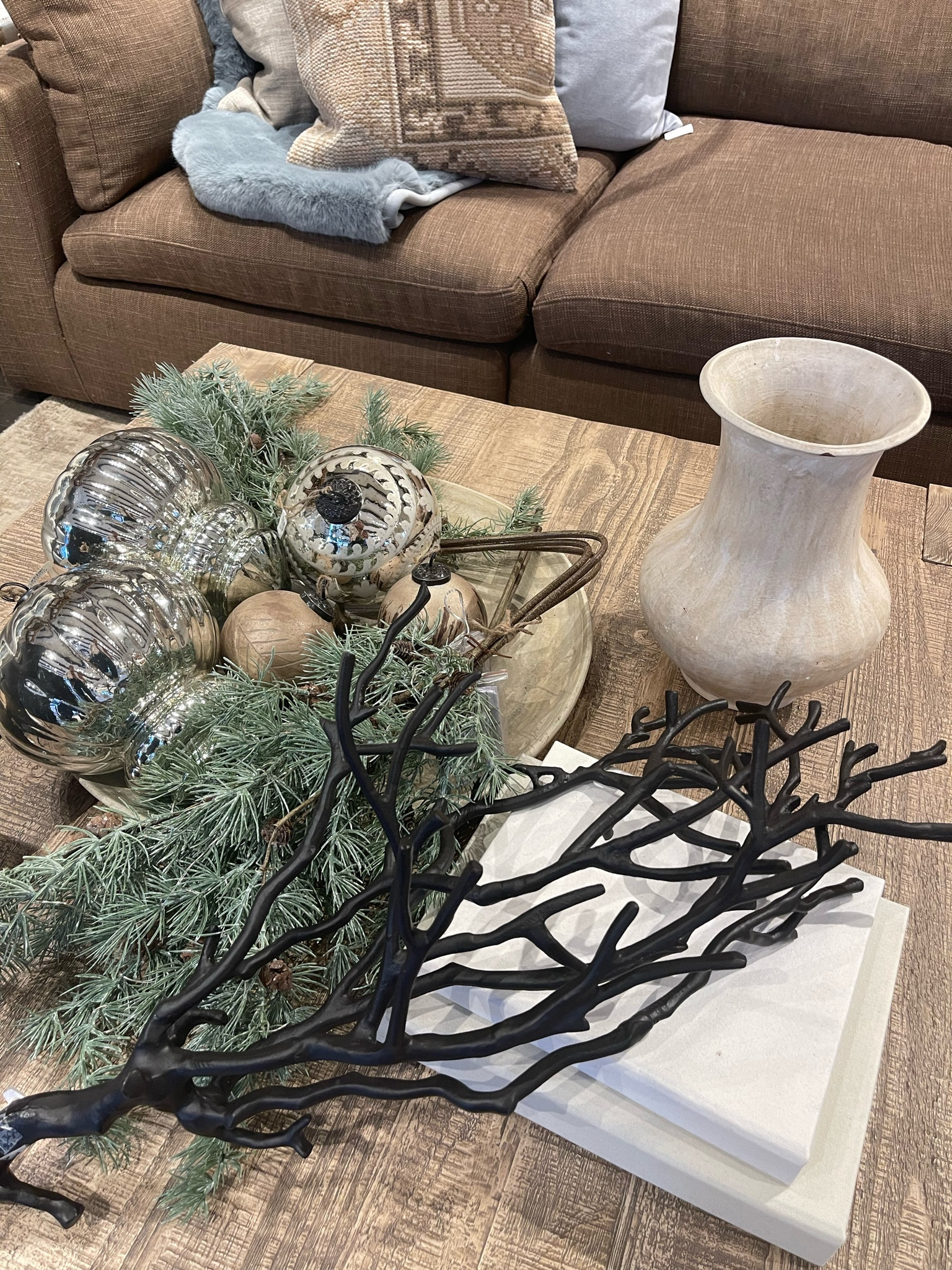 Subtly blending Thanksgiving with Christmas vibes for a smooth transition.

Ornaments. Wooden tray. Candles. Pillows. Sectional couch. Throw blanket. Fabric sectional. Branch decoration. Christmas ornaments. Bells. Christmas bells. Vase. Ceramic vase. Christmas decor. Thanksgiving decor. Fall decor. Winter decor. Home decor. Christmas home decor. 

#jenniferxerin #stylewithjen #barelyblonde #interiordesignerella

#LTKhome #LTKfindsunder100 #LTKHoliday