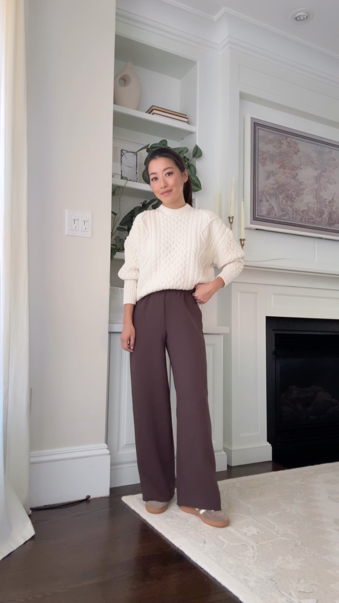 A favorite outfit featuring quality, elevated staples

• Aritzia lodge pants in 2XS short - the best! pull on elastic waist, wrinkle resistant and beautiful drape

• Hi-hip (aka shorter length) cable sweater sz XS, I sized up for a relaxed fit. Amazing quality chunky knit, thick and warm weight. FYI the neck was a little snug at first but I gently loosened it. Hand wash this cold and air dry.

• New Balance 9060s very cushioned and comfortable. A big kids size 4 = womens 6. 

A big kids size 3.5 fits like a womens 5.5.

• J.Crew double faced (unlined) wool coat XXS Petite runs big

• Madewell brown bag

• love these cushioned socks in Xs / s 

airport travel outfit, thanksgiving cozy style, petite pants , easy sneakers looks , busy mom 

 

#LTKTravel #LTKWorkwear #LTKPetite