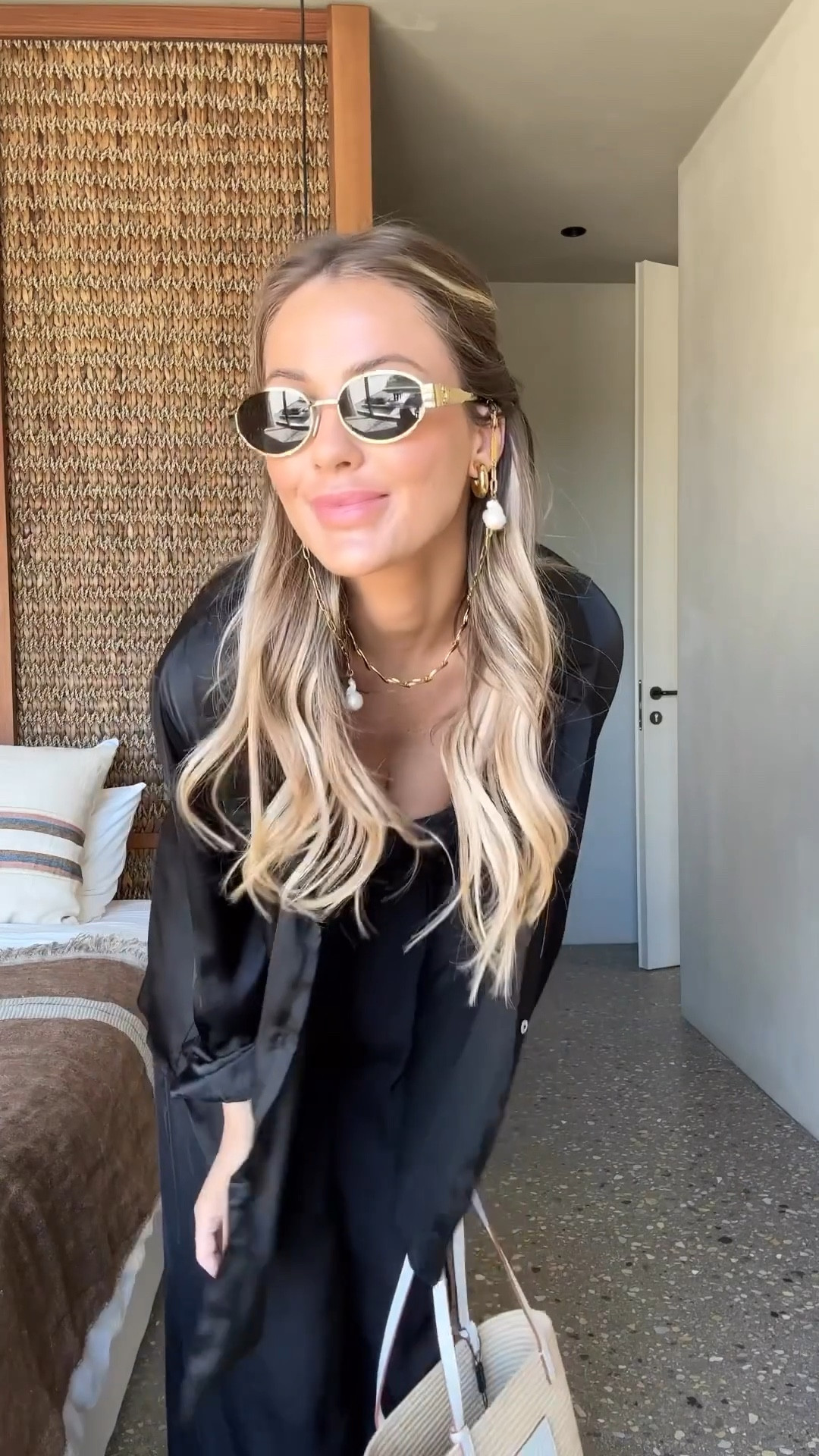 Black satin shirt and trouser co-ord, pearl sunglasses chain, strapless bikini, fendi sandals 

#LTKeurope #LTKstyletip #LTKswim