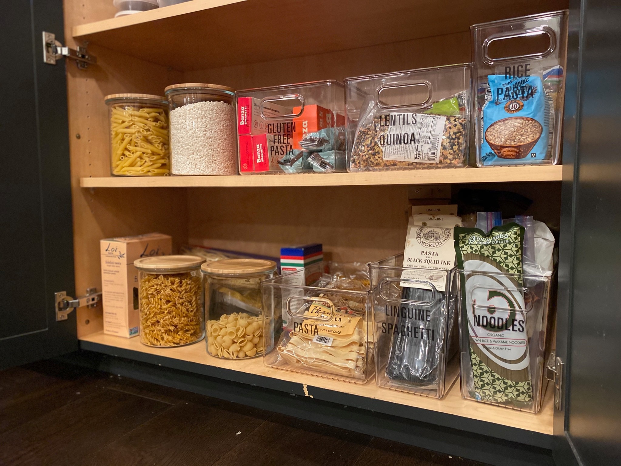 Acrylic bins and glass jars in pantries like this one make it easy to see what you have and what you need more of!

#LTKfamily #LTKhome
