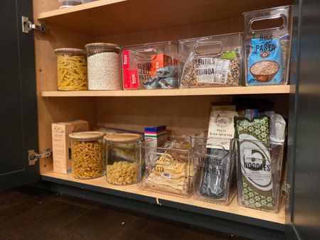 Acrylic bins and glass jars in pantries like this one make it easy to see what you have and what you need more of!

#LTKfamily #LTKhome