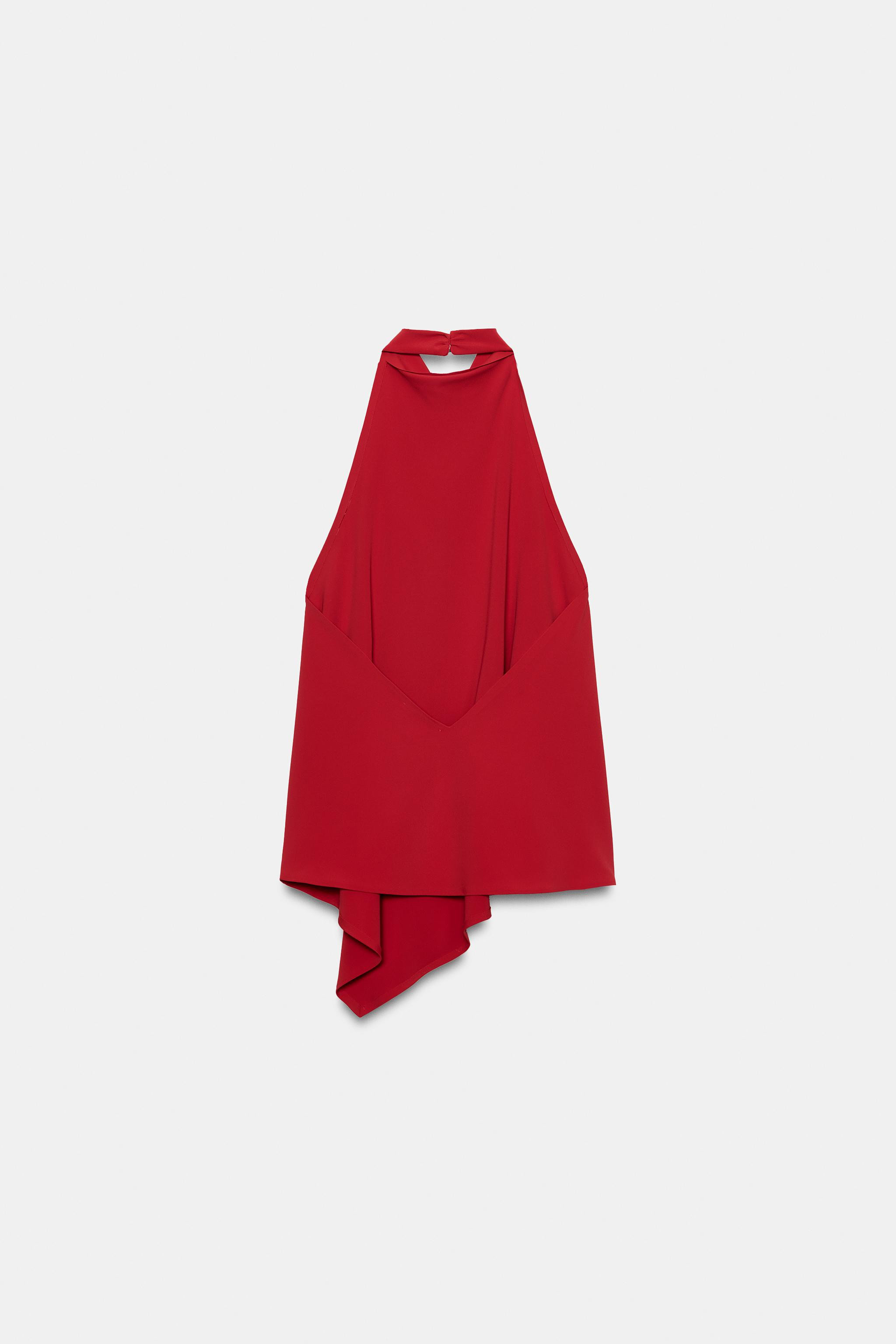 Top crafted from stretch fabric. Features a halter neckline and an asymmetric hem. Button closure... | Zara US