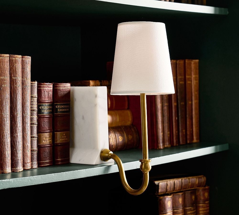 Pottery Barn Chris Loves Julia sconce for bookshelf 

#LTKHome #LTKSeasonal #LTKmomlife