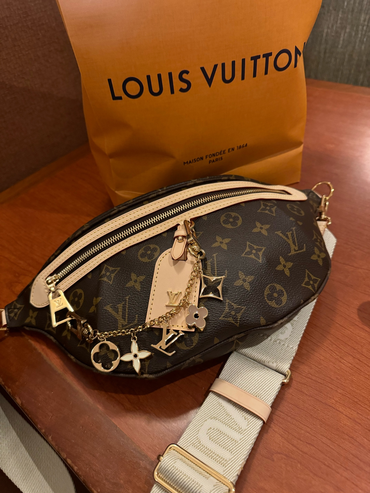 I love my limited edition, Louis Vuitton bum bag I carried all the time, especially when I am traveling. I thought this was cute and I like adding the charms to add a little bit of edge. I can’t find the exact charms and I cannot link directly from Louis Vuitton, but I found the same bag on eBay. 

#LTKItBag