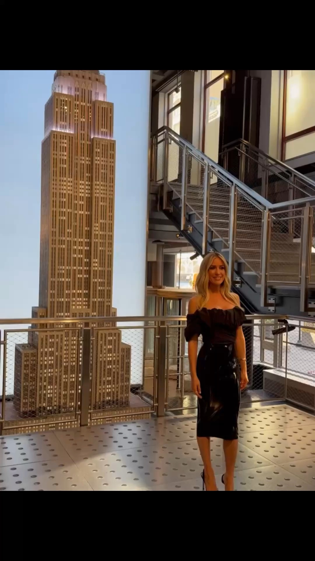 Kristin Cavalleri's off the shoulder black ruffle top and latex black midi skirt ￼