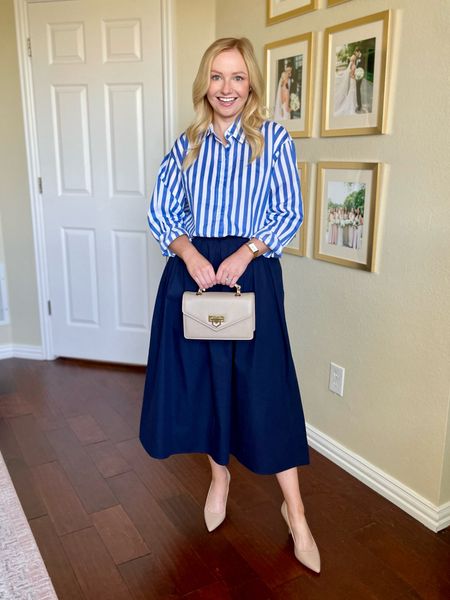 Wearing a 0 in skirt (runs a little large!) and XS in top | classic outfit, midi skirt, navy skirt, striped button down, nude pumps, workwear, work outfit, spring workwear 

#LTKworkwear #LTKSeasonal #LTKstyletip