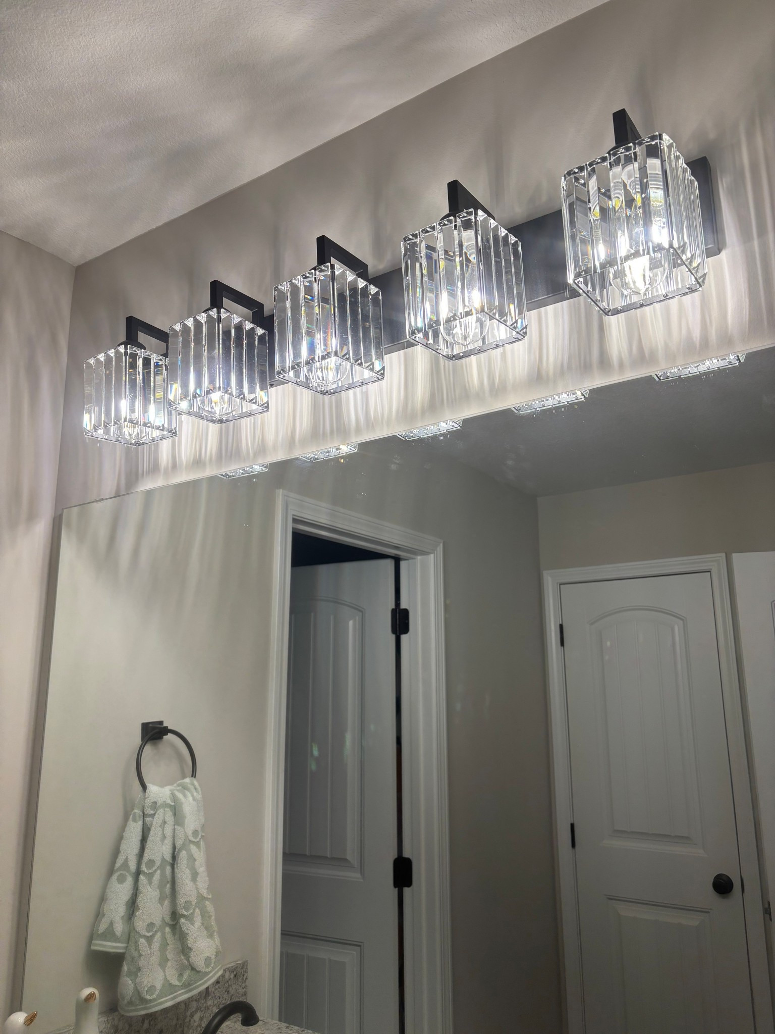 Been loving this long crystal vanity light in our guest bathroom! 

#LTKHome