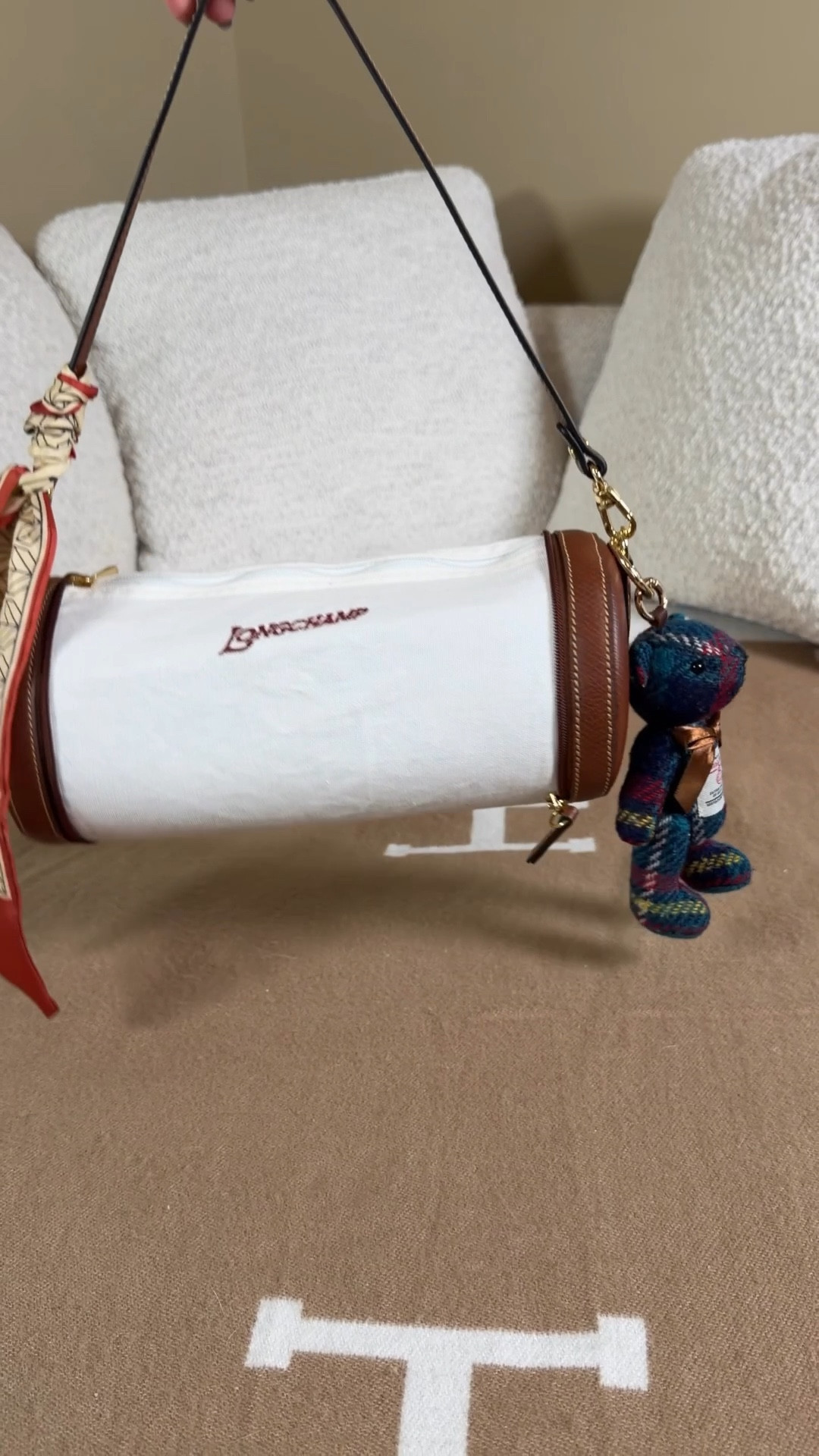 What fits in the Longchamp epure barrel bag ❤️ the insert makes it hold the cute barrel shape!

I love how this bag starts out looking like a tiny coin pouch (and can be worn that way) but also has a little surprise what you open her up and can turn her into a cool vintage vibe barrel bag. She gives me vintage sporty vibes with the embroidered Longchamp font and colors 

I was able to fit a Coach outlet card holder/ mini wallet
A Harris tweed coin pouch with touchland hand sanitizer, gisou honey lip oil and vacation spf stick for more vintage vibes
Salt and stone hand lotion
Claw clip
Change lipstick
A tortoise shell colored French hair pin with my initial on it 
Then finished it off with a Twilly and Harris tweed bear bag charm
Bag insert
Barrel bag insert 
Papion insert
#LTKSpringSale

#LTKdayinmylife #LTKootd