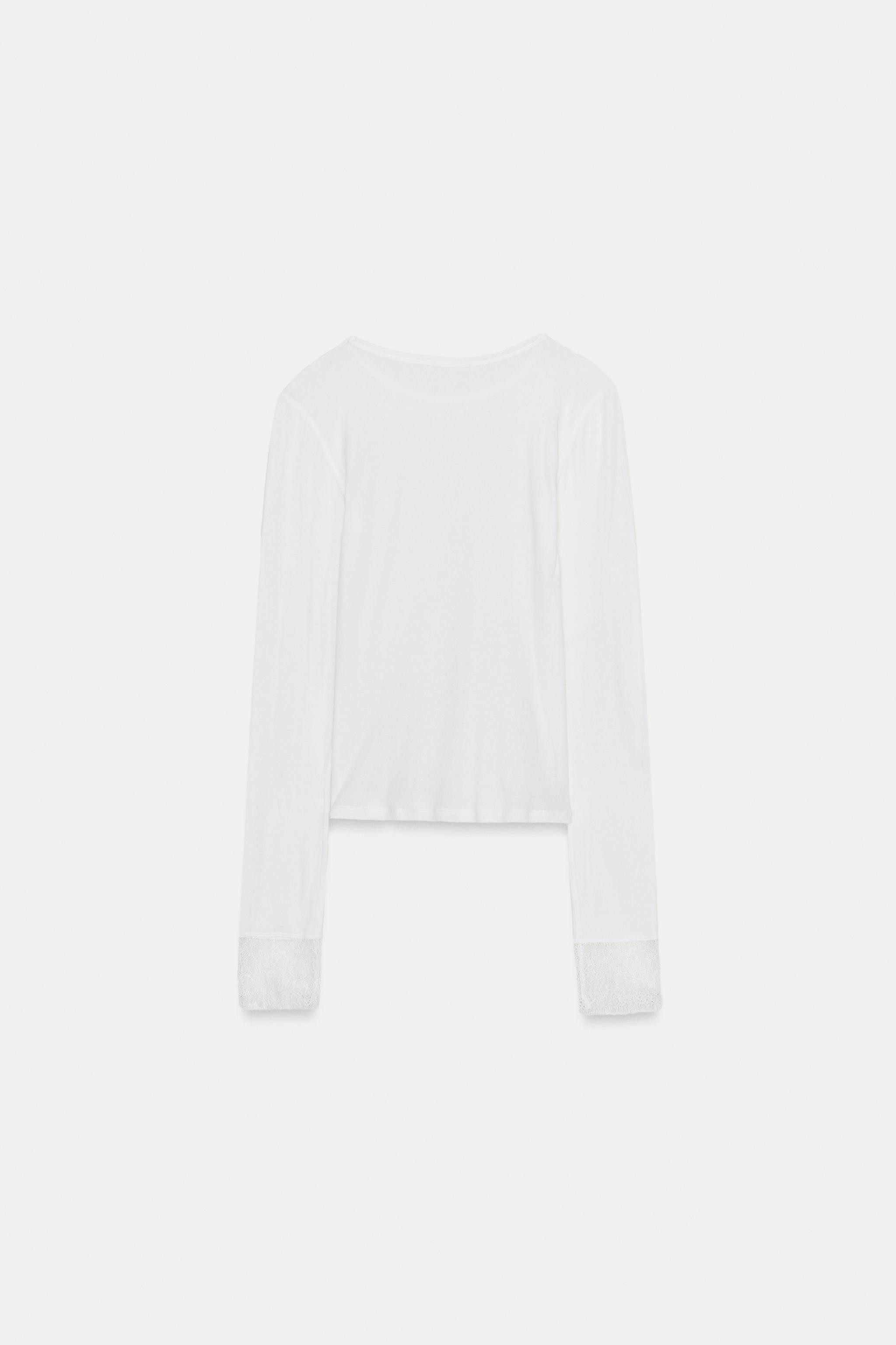 Main fabric top made of 100% cotton. Round neck and long sleeves with lace cuffs. | Zara US