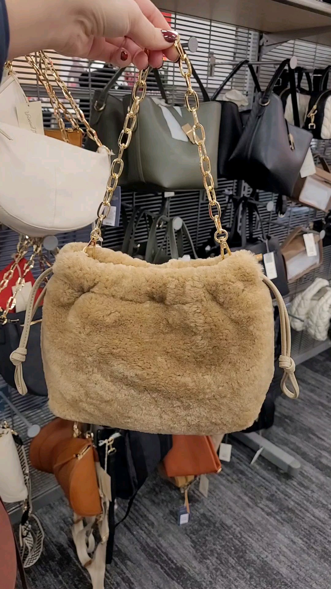 I found the cutest drawstring faux fur handbag to go with your holiday party outfits or ootds all winter long! Use it as a clutch or with the gold chain hand strap!

#LTKWatchNow #LTKItBag #LTKFindsUnder50