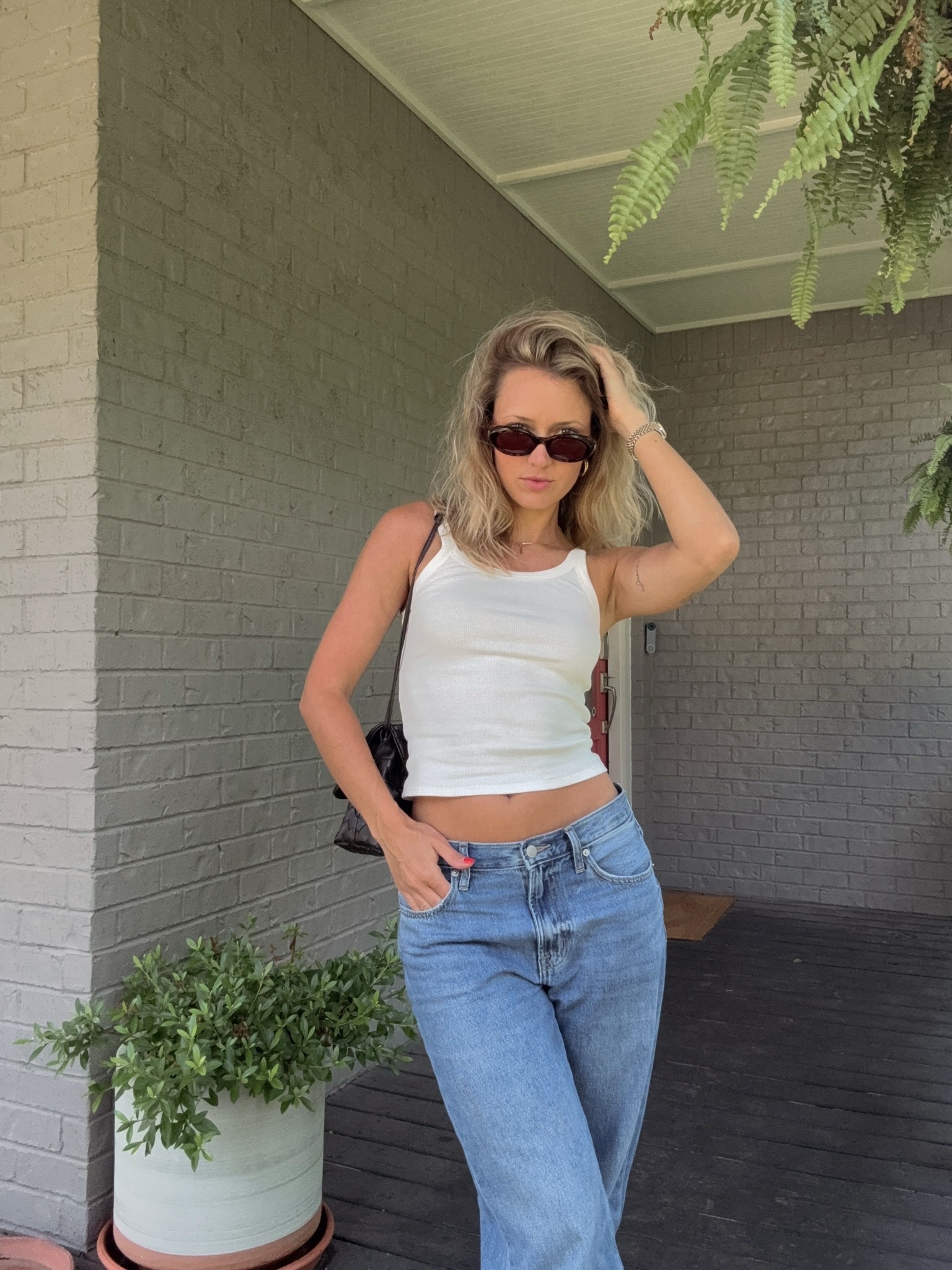 Sometimes I think we make it too complicated. If you buy quality basics that fit perfectly (or have things tailored!) then you don’t need to do much to throw together a great outfit. I love the length of this tank and the slightly off white shade. Pair it with baggy jeans I’ve been living in and some elevated accessories in classic chocolate brown and I feel like a cute and confident cool girl!! 🤎✨

#LTKootd