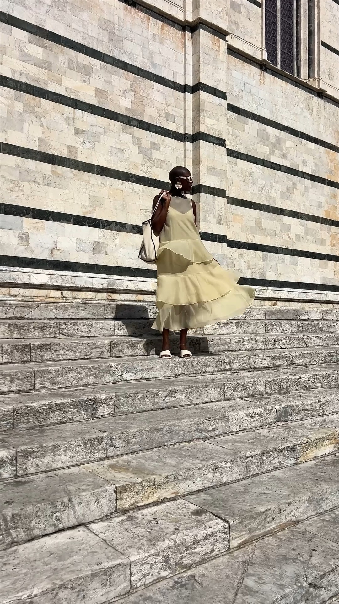 Soft creamy yellow tiered organza dress that will be perfect for holiday dressing! My eye patches are YSE, my brown pencil is It cosmetics, my walking sneakers are ascis are are like a pillow for your feet.