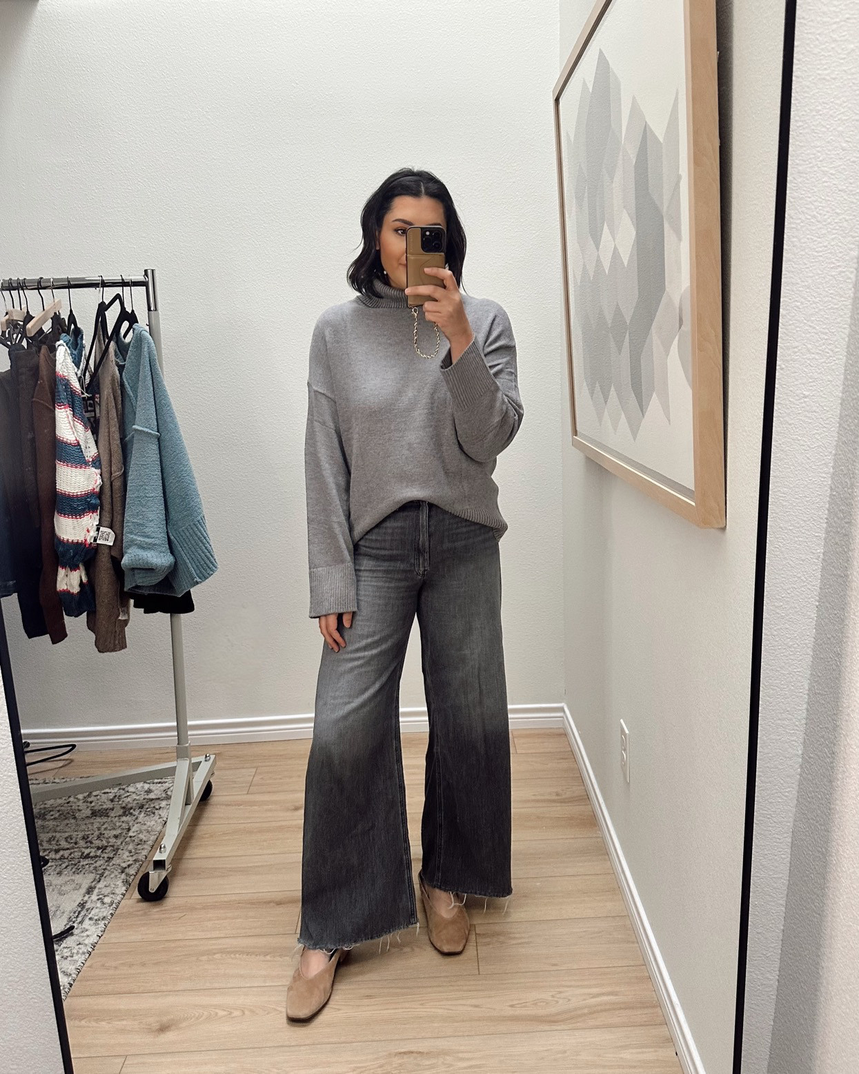 I'm in the large of the sweater -- it runs true to size with a relaxed fit! 

I'm in the 30 of the grey jeans, 30 of the dark blue jeans. 

 