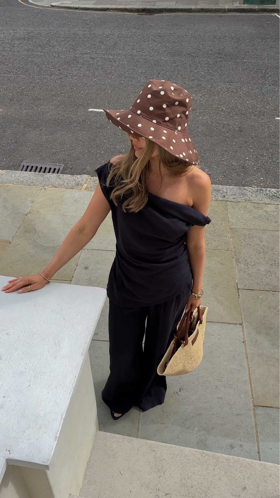 Tala black linen top, Tala black linen trousers. Chic holiday outfit, Black linen co-ord, black linen top, black linen trousers, linen two piece set, off shoulder top, draped black top, wide leg linen trousers, black summer outfit, neutral summer style, effortless chic, quiet luxury style, old money aesthetic, elevated basics, minimalist fashion, capsule wardrobe, vacation outfit, holiday outfit, European summer style, Mediterranean style, resort wear, luxury travel outfit, city break outfit, summer evening outfit, dinner outfit, date night outfit, monochrome outfit, black co-ord set, black matching set, elegant summer outfit, timeless style, classic wardrobe staples, understated luxury, sophisticated outfit, linen fashion, breathable summer outfit, vacation fashion, coastal chic, French girl style, Italian summer fashion, relaxed tailoring, wide leg trousers, elevated casual, everyday luxury, chic black outfit, summer capsule wardrobe, neutral accessories, woven straw bag, raffia tote bag, summer accessories, polka dot sun hat, floppy sun hat, statement hat, beach club outfit, holiday evening look, vacation dinner outfit, resort chic, effortless elegance, feminine style, polished summer look, designer-inspired style, luxury aesthetic, summer fashion inspo, outfit inspiration, holiday style, vacation wardrobe, linen lovers, chic dressing, elegant fashion, timeless elegance, neutral wardrobe, black outfit inspiration

I am wearing a size XS in top and S in bottoms, top comes up bigger than standard I would say so I sized down

#LTKuk #LTKsummer #LTKstyletip