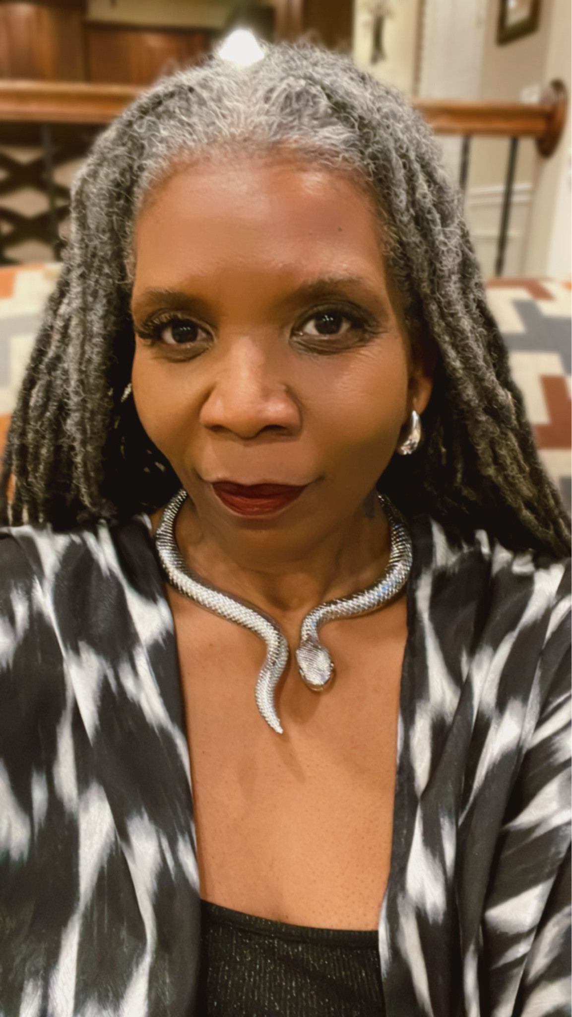 In full grandma mode, but this isn't your grandma's kimono. This is a statement piece from #Diarrablu for a queen who's been reigning supreme for half a century. Platinum dreads flowin', Bottega Venetta blingin', and a silver snake slitherin' around my neck - I'm here to remind you that age is just a number, and style is a lifetime commitment.

 #BlackGirlMagic #Over50andFabulous #KimonoQueen #PlatinumPower #SlayAllDay #SilverSerpent #BottegaVibes #FashionAtEveryAge #TrendingNow #GetThisLook #ConfidenceIsKey

#LTKMostLoved #LTKstyletip